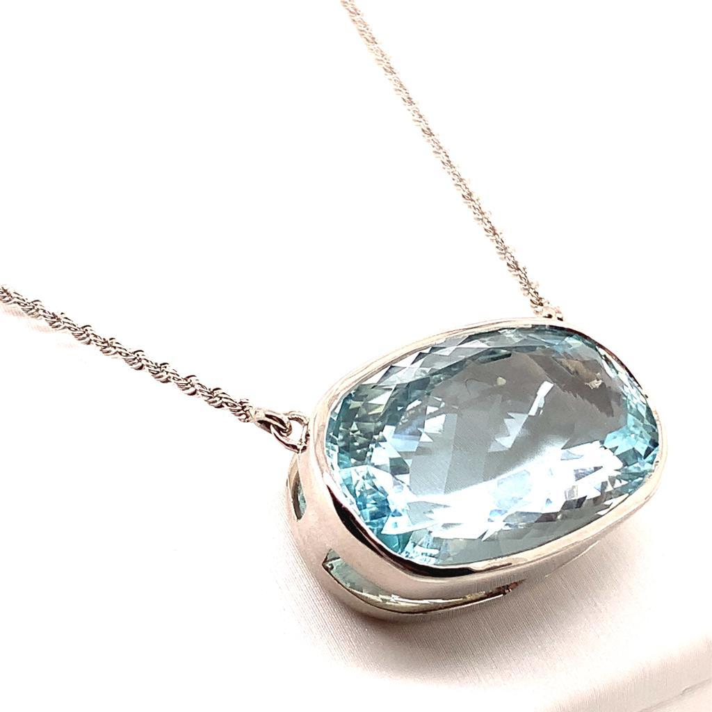 This necklace features a Solitaire Oblong Cushion cut Aquamarine weighing approximately 22.51 carats. The Aquamarine speaks out for itself and captures the attention of its viewers with its captivating colour and gleaming magnificence. 