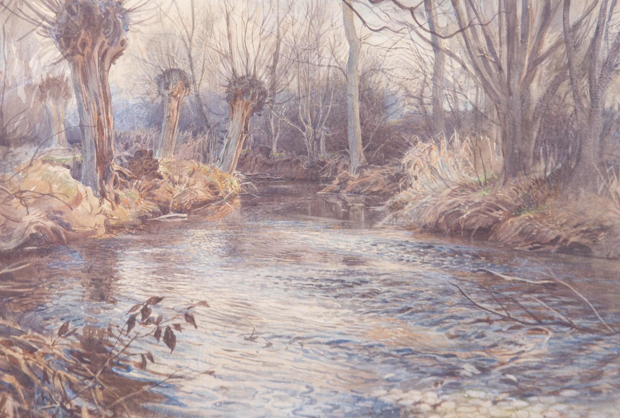 A very fine early 20th century watercolour landscape attributed to the English artist William Edward Wigley (1880-1943). Depicting an atmospheric winter river scene with willow trees lining the bank. Excellently presented in a washline mount and