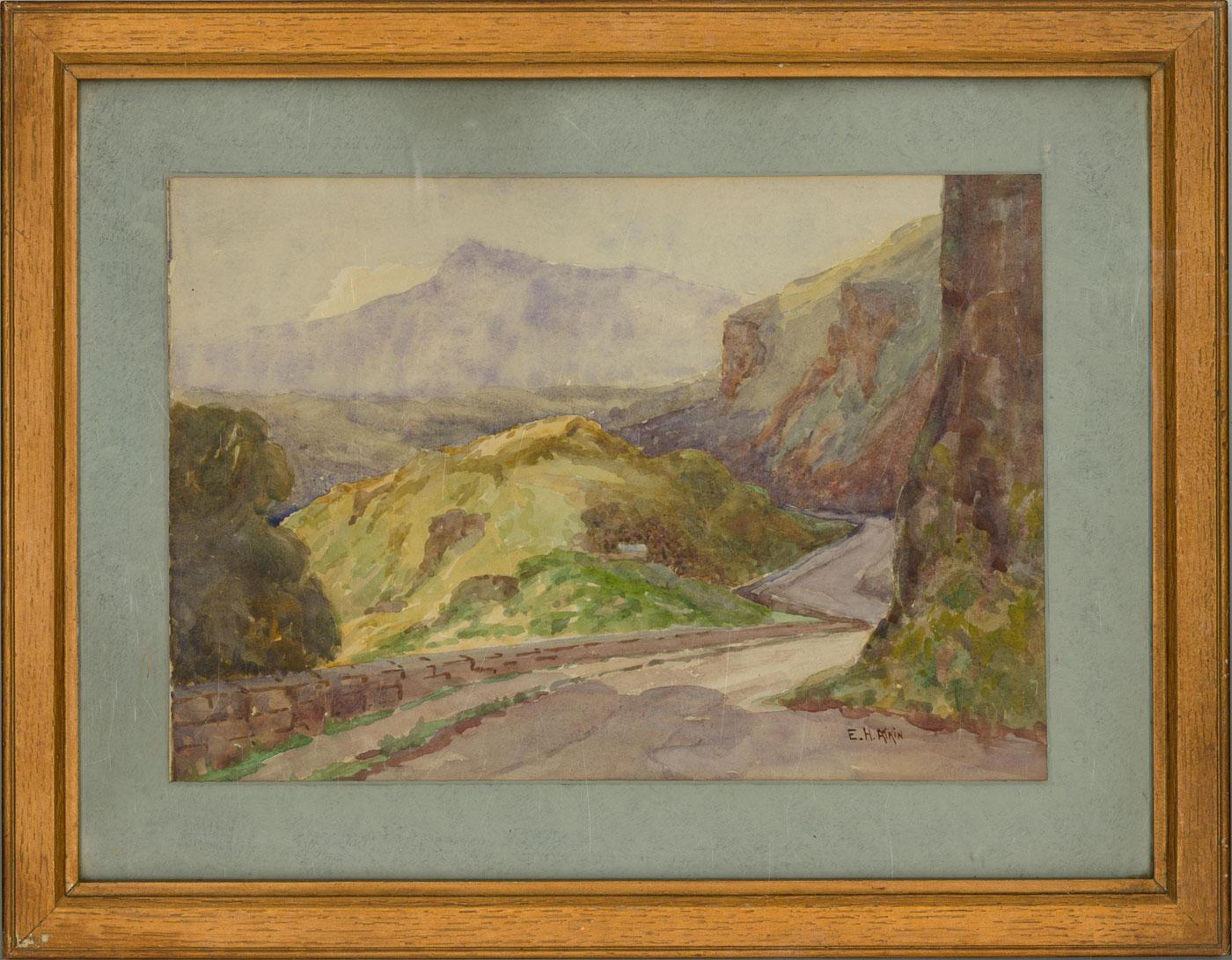 An idyllic watercolor depicting a winding mountainside road.

Signed.

Well presented in a wood frame with glazing and a blue mount board.

On wove.