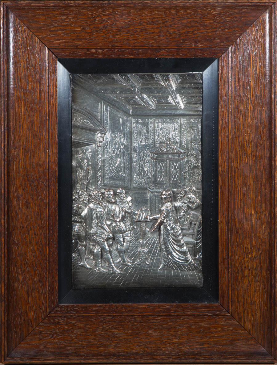 Expert use of repoussage, chasing, and other relief-working techniques are used to create a sublimely intricate and detailed interior court scene, finished with silver plating.

Well presented in a substantial dark wood frame with a black wood slip.
