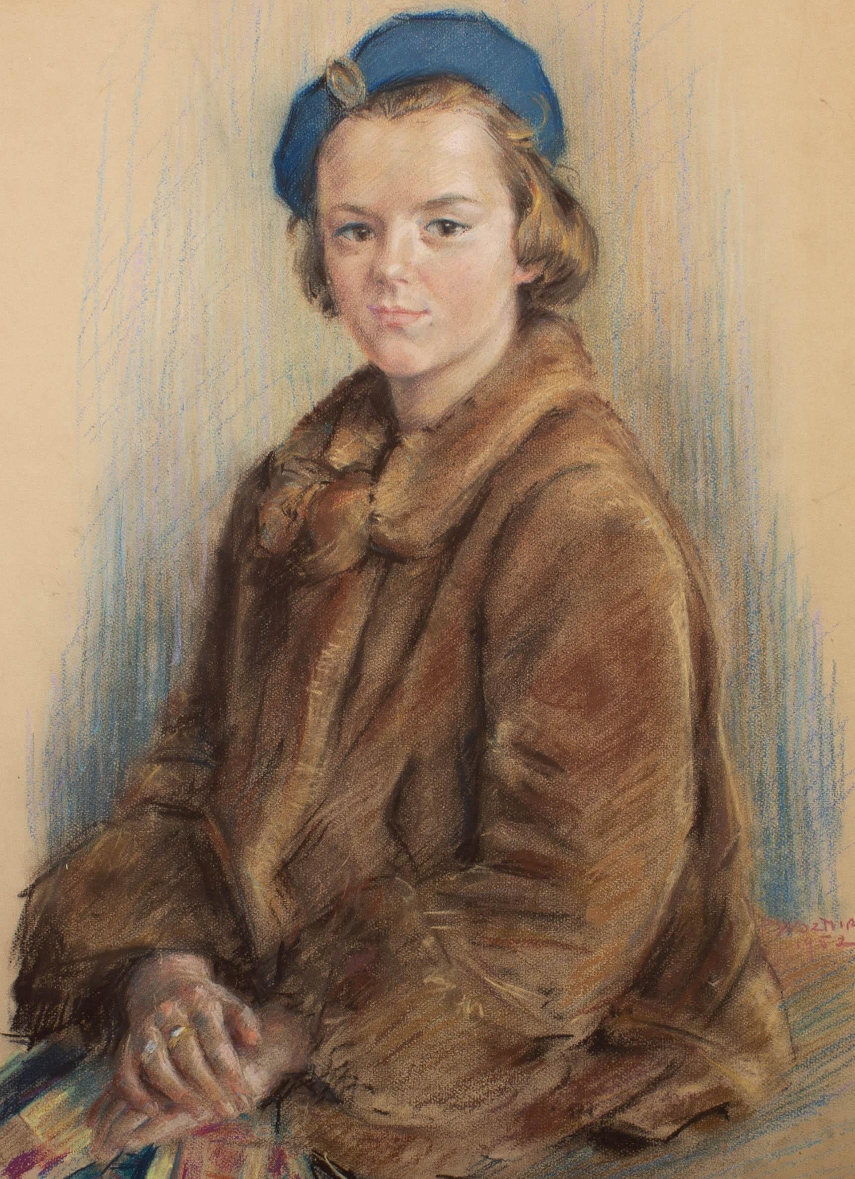 An elegant pastel portrait of a young lady in a fashionable fur coat and blue beret. The artist has signed and dated to the lower right and the portrait is on wove board. On wove board.
