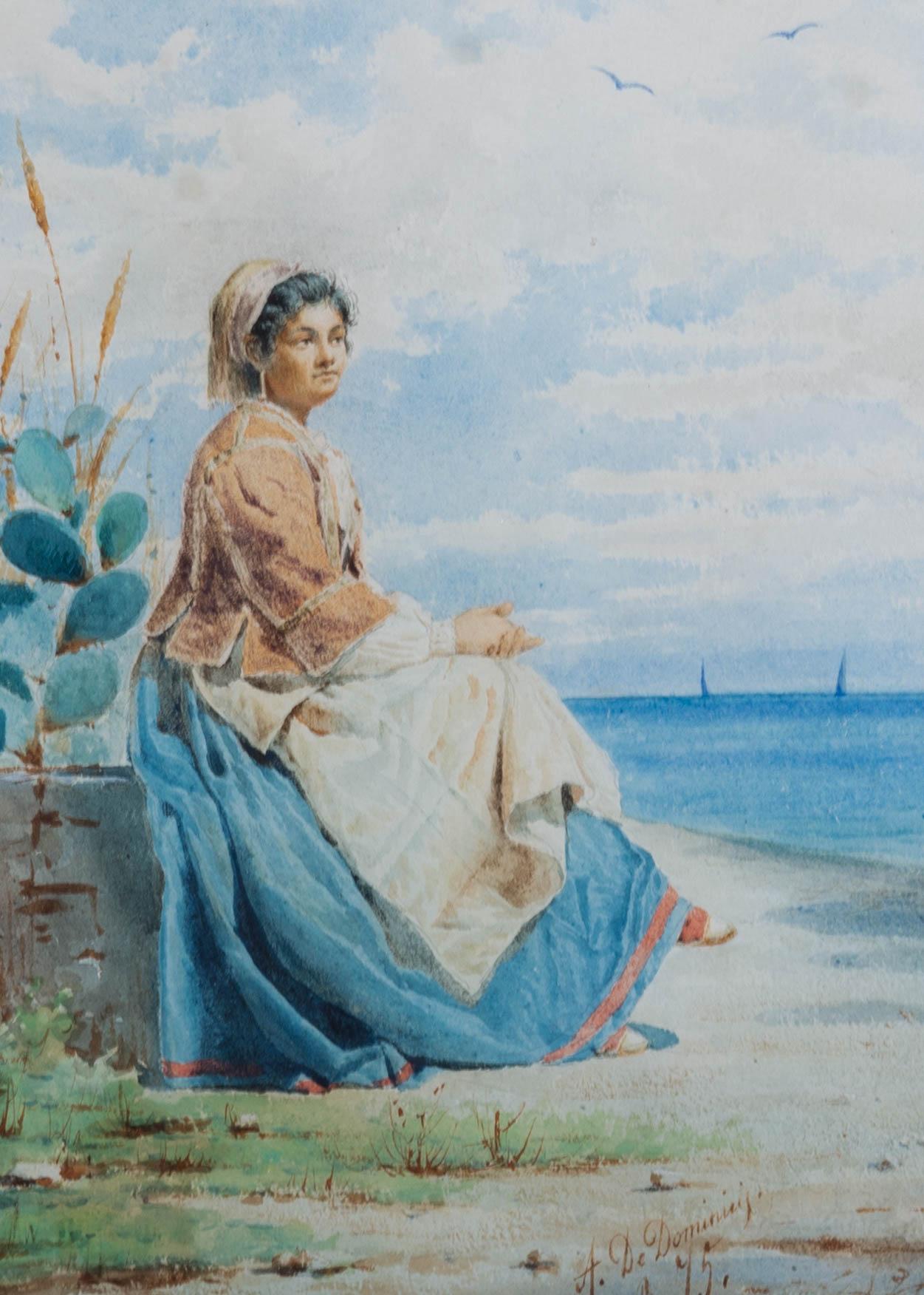 A very fine watercolour study by the Italian painter Achille De Dominicis (1851-1917). Here the artist has depicted a pretty young Italian woman, she is seated on a stone wall as she looks out to sea. The fine brushwork and warm colour palette are
