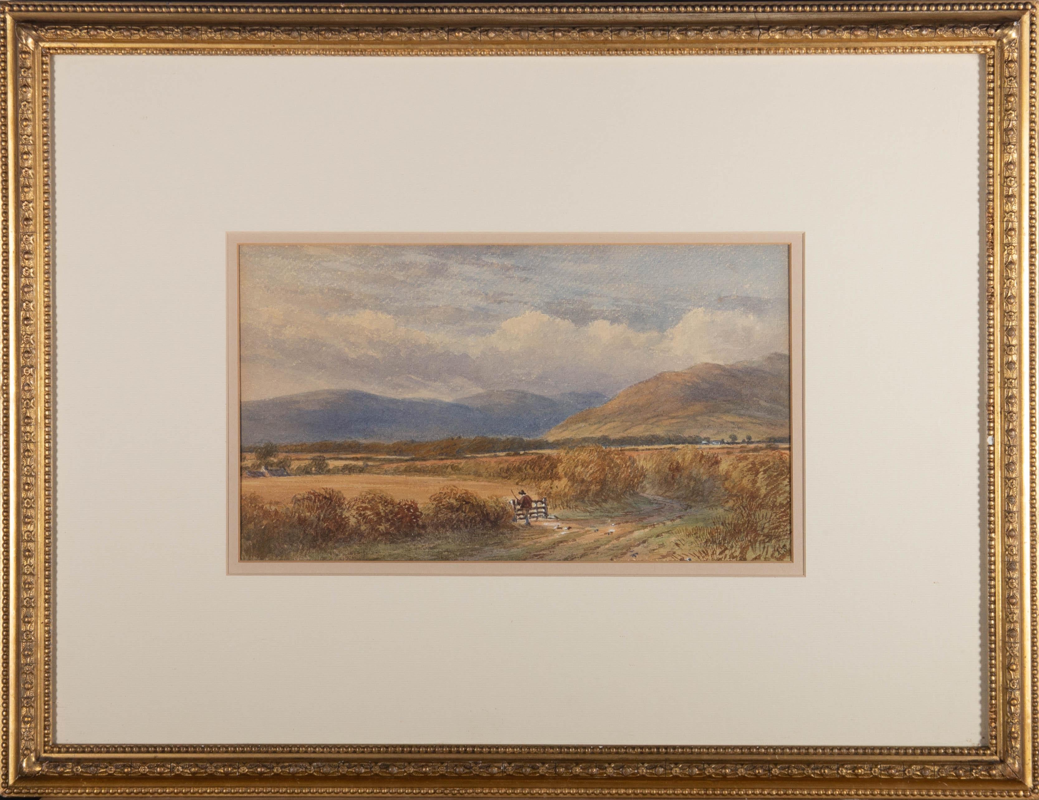 A landscape view in a mountain valley with a figure passing through a gate in the foreground. Presented glazed in a white and beige double mount and a gilt frame with bead courses to the inner and outer edges. Initialled to the lower-right corner.