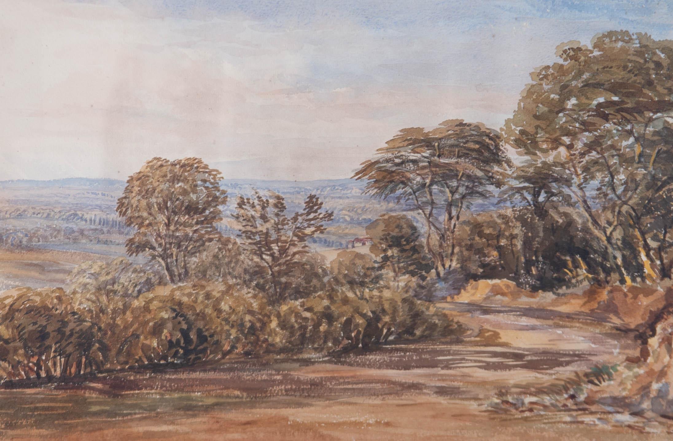 A far-reaching landscape depicting a winding country road that leads the eye through trees to a house and hills beyond. Presented glazed in a cream mount and distressed gilt-effect frame. Unsigned. On wove.
