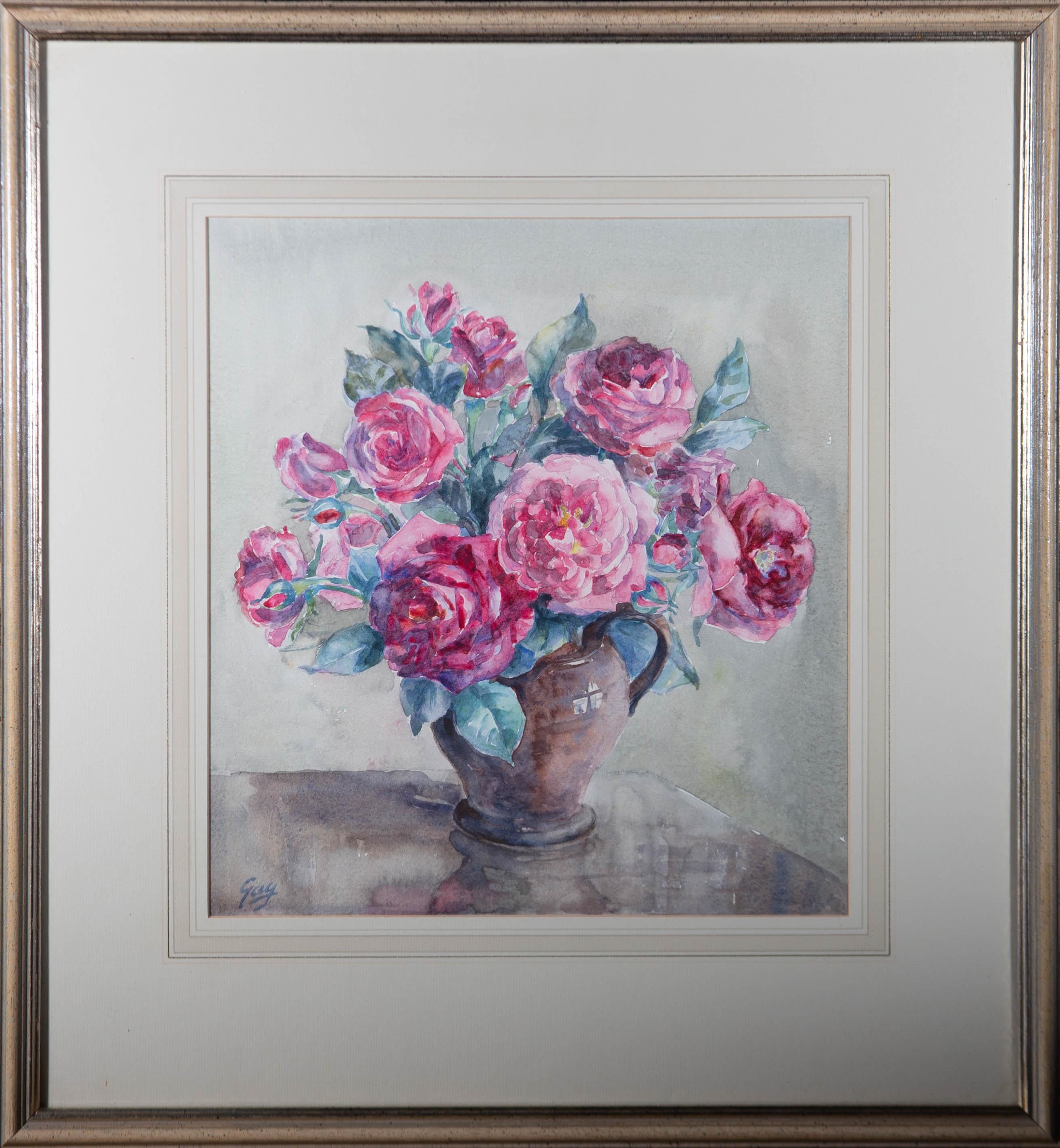A charming watercolour painting, depicting a still life of roses in a jug. Signed to the lower left-hand corner. Well-presented in a wash line card mount and in a speckled frame with gilt details. On watercolour paper.