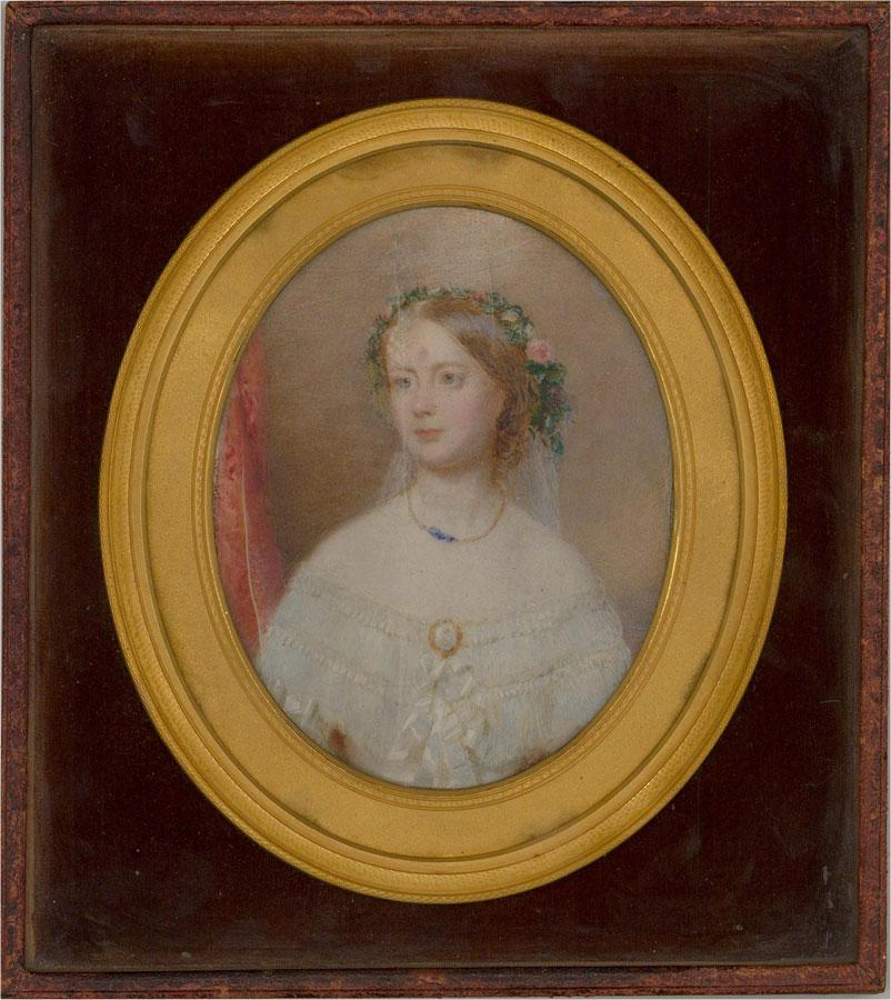A delicate Victorian miniature portrait, exquisite in both its execution and presentation. The portrait shows a beautiful young bride, with rosy cheeks, in a wedding dress of a style fashionable in the 1850s. She wears a delicate veil, hanging from