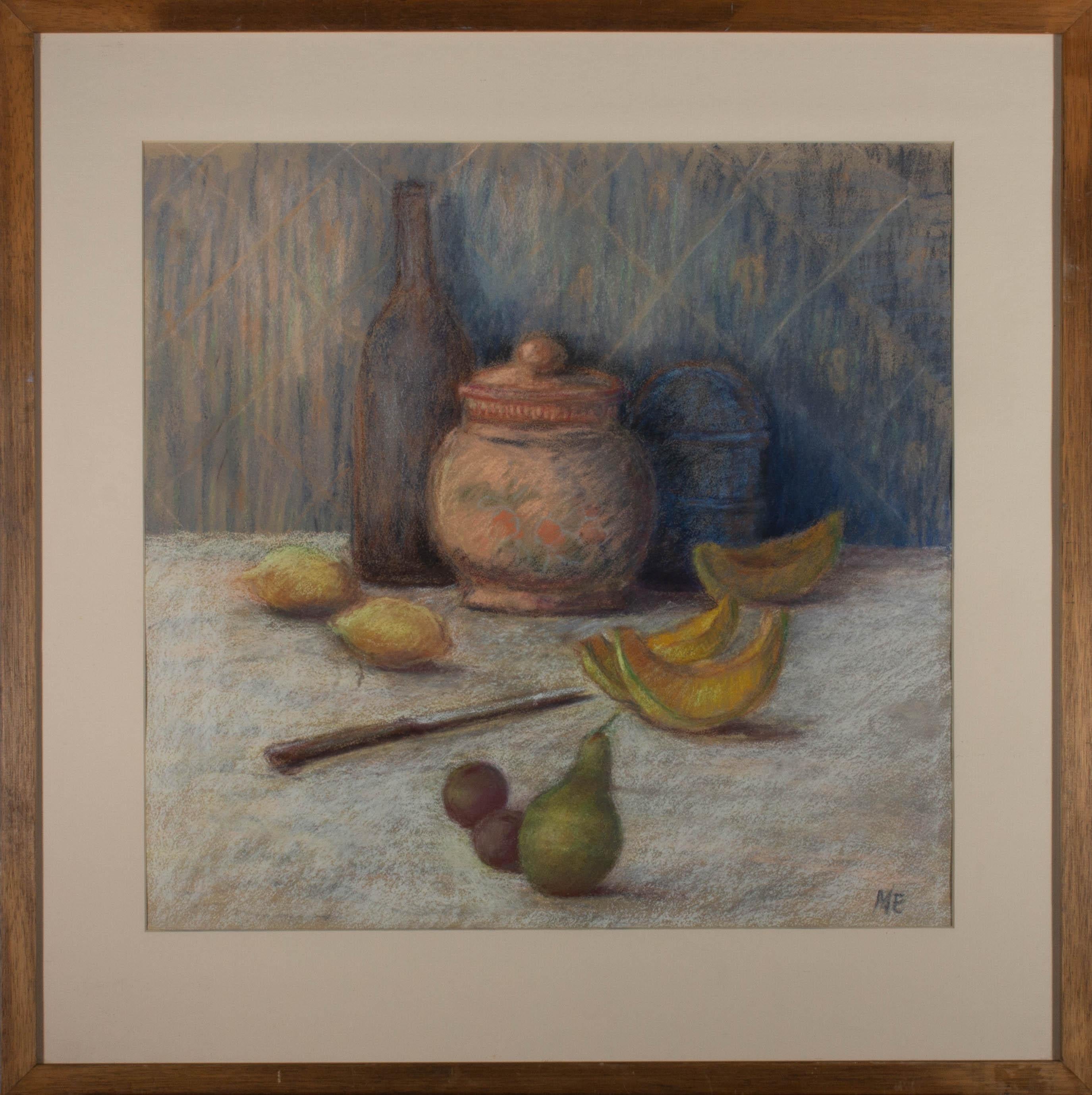 A charming still life in pastel showing a lidded pink pot and other vessels with an array of fruit in front. The artist has used a muted palette and gentle light to add naturalism to the otherwise, impressionistic still life. The artist has