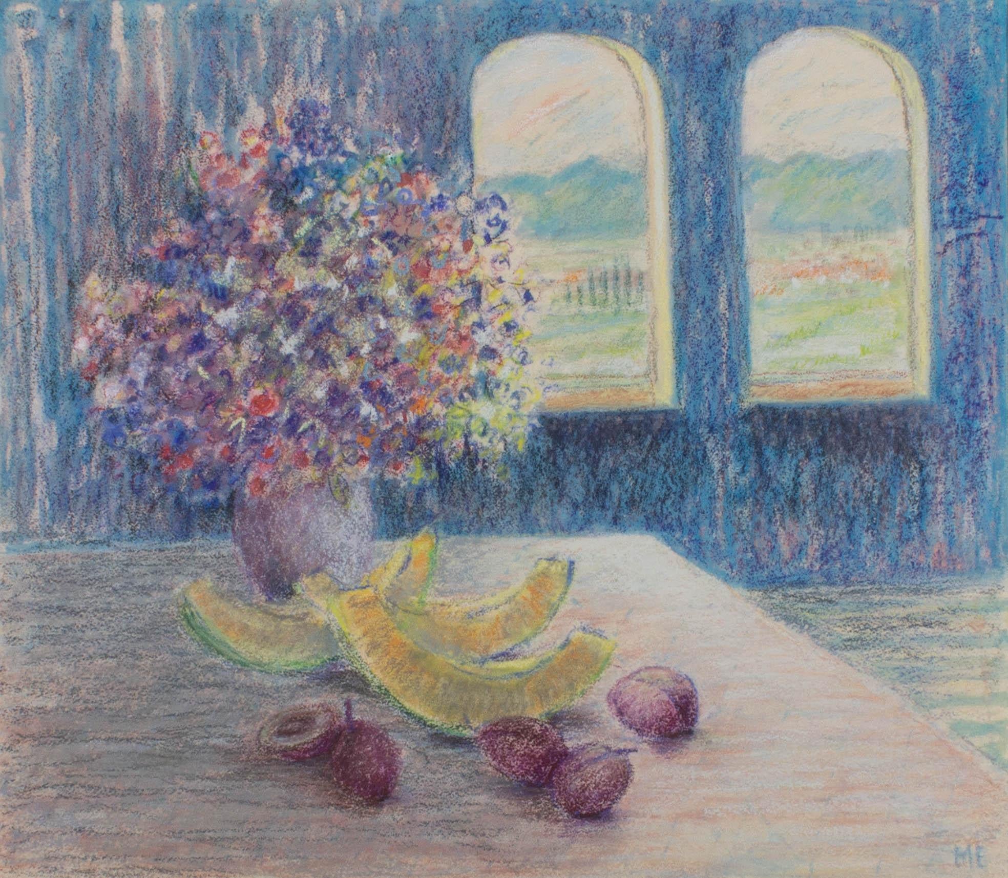 A soft and hzy interior scene with a botanical still life of flowers and fruit on a table. A view of a continental countryside can be seen through the arched windows. The artist has initialed to the lower right corner and the drawing has been