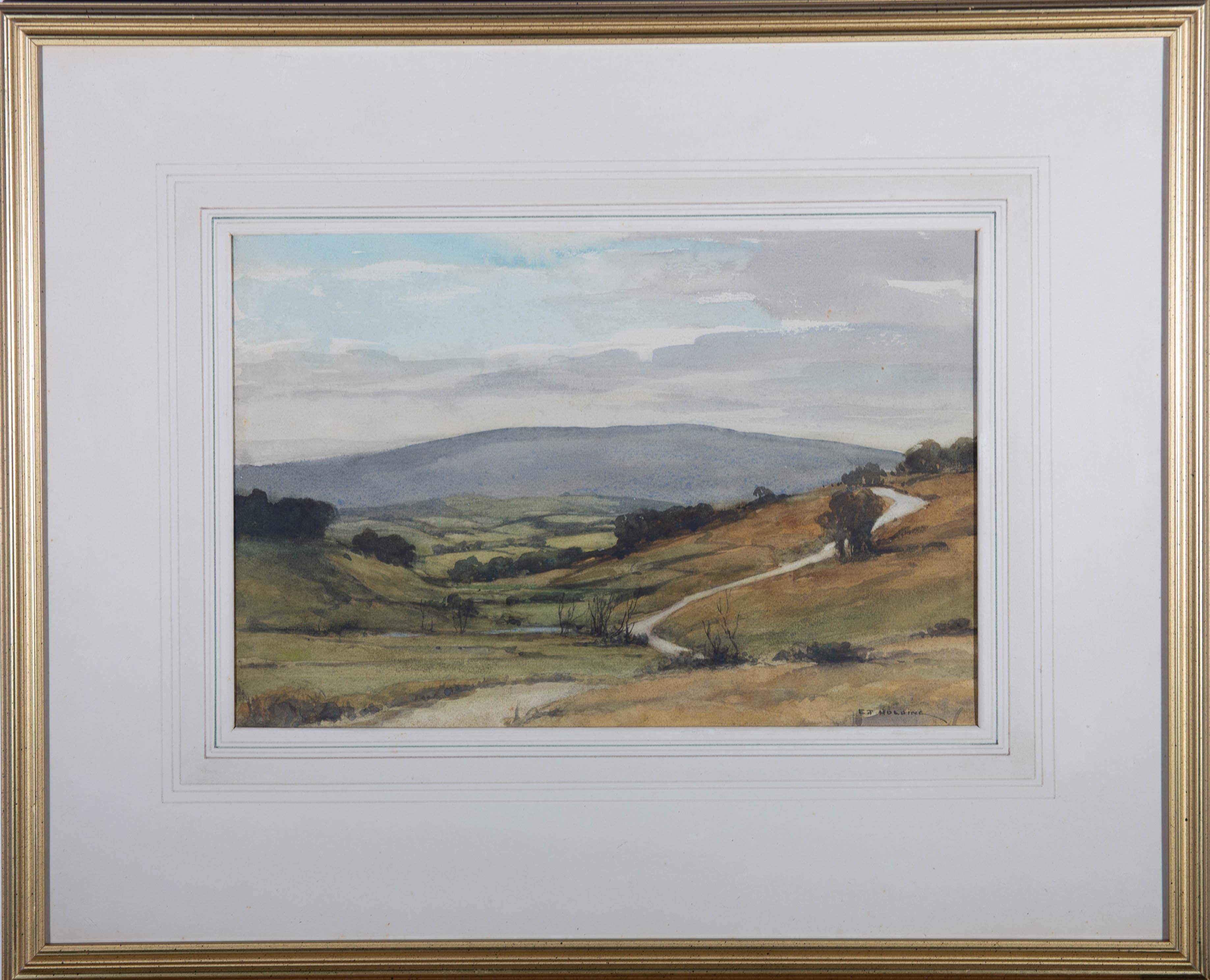 Una bella rappresentazione ad acquerello dei campi e delle colline di Dartmoor. L'artista ha apposto la sua firma in basso a destra e il dipinto è stato presentato in una cornice dorata con un'attraente montatura con linee di lavaggio. L'etichetta