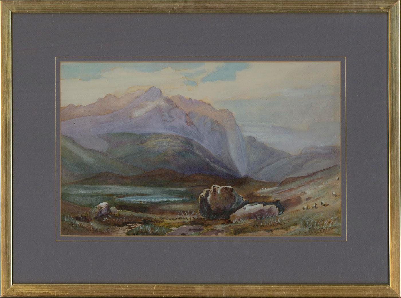 A dramatic mountain landscape with sheep grazing in the foreground. Presented in a blue mount with gold detailing and a gilt-effect frame. Signed to the lower-right corner. On watercolour paper.
