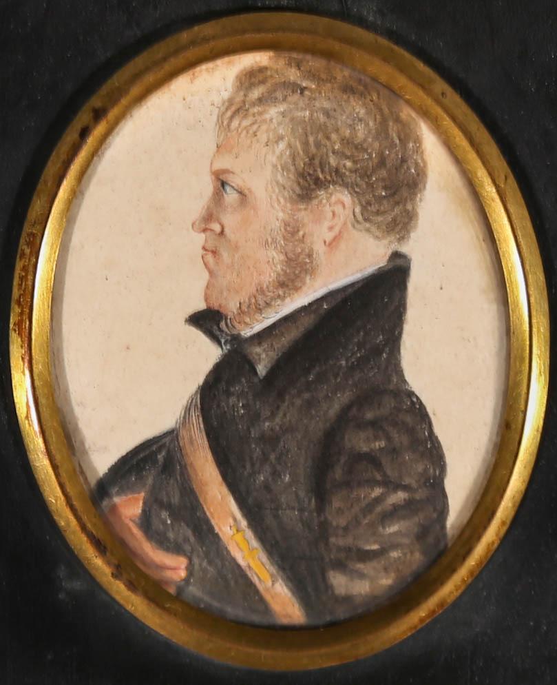 A charming miniature portrait from the early 19th Century (Likely Regency), showing a grumpy man with an impressive chin strap beard. He is wearing the yellow dagger shaped pin badge of the Royal Marines (founded in 1664) on his leather sash. The