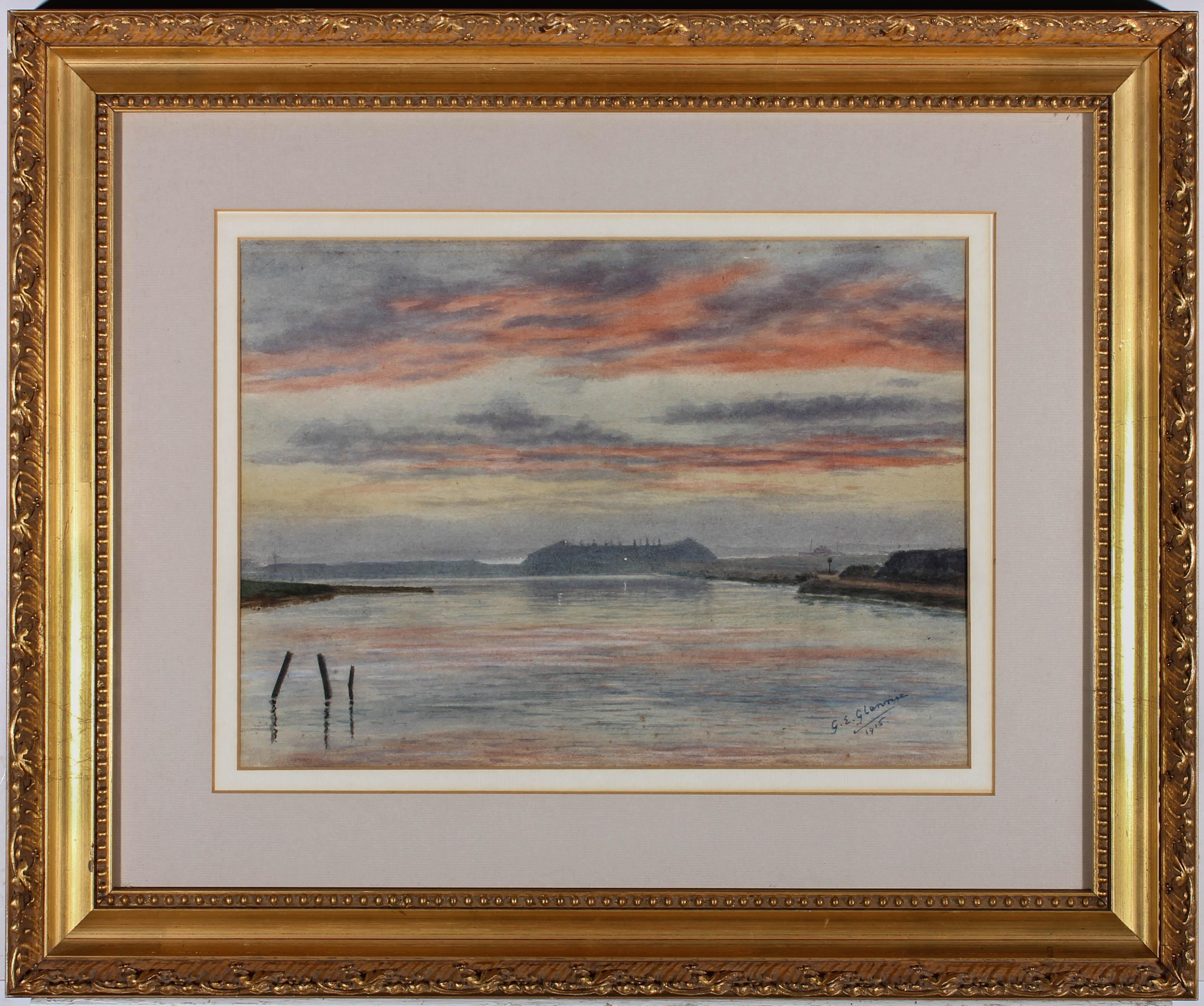 A misty harbour seascape, with cooling hues of pink and purple in the sky and quiet waters. Signed and dated to the lower right-hand corner. Attractively presented in a gilt-effect frame and double card mount. Glazed. On paper.

