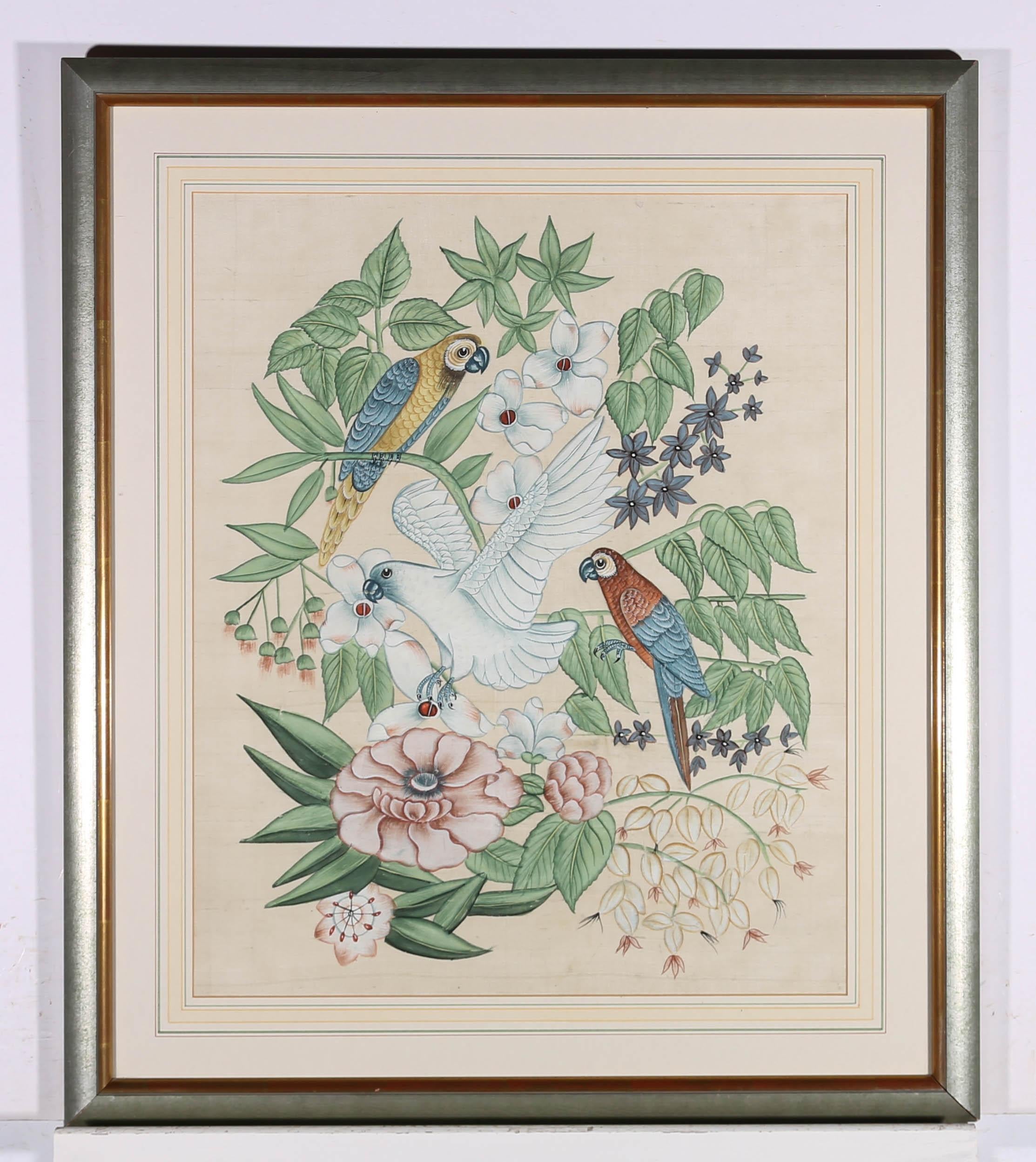 A beautiful 20th Century gouache on cotton silk, showing colourful parrots entwined in flowers and foliage. The painting is unsigned and presented in a 20th Century silver frame with wash-line mount. On silk cotton.

