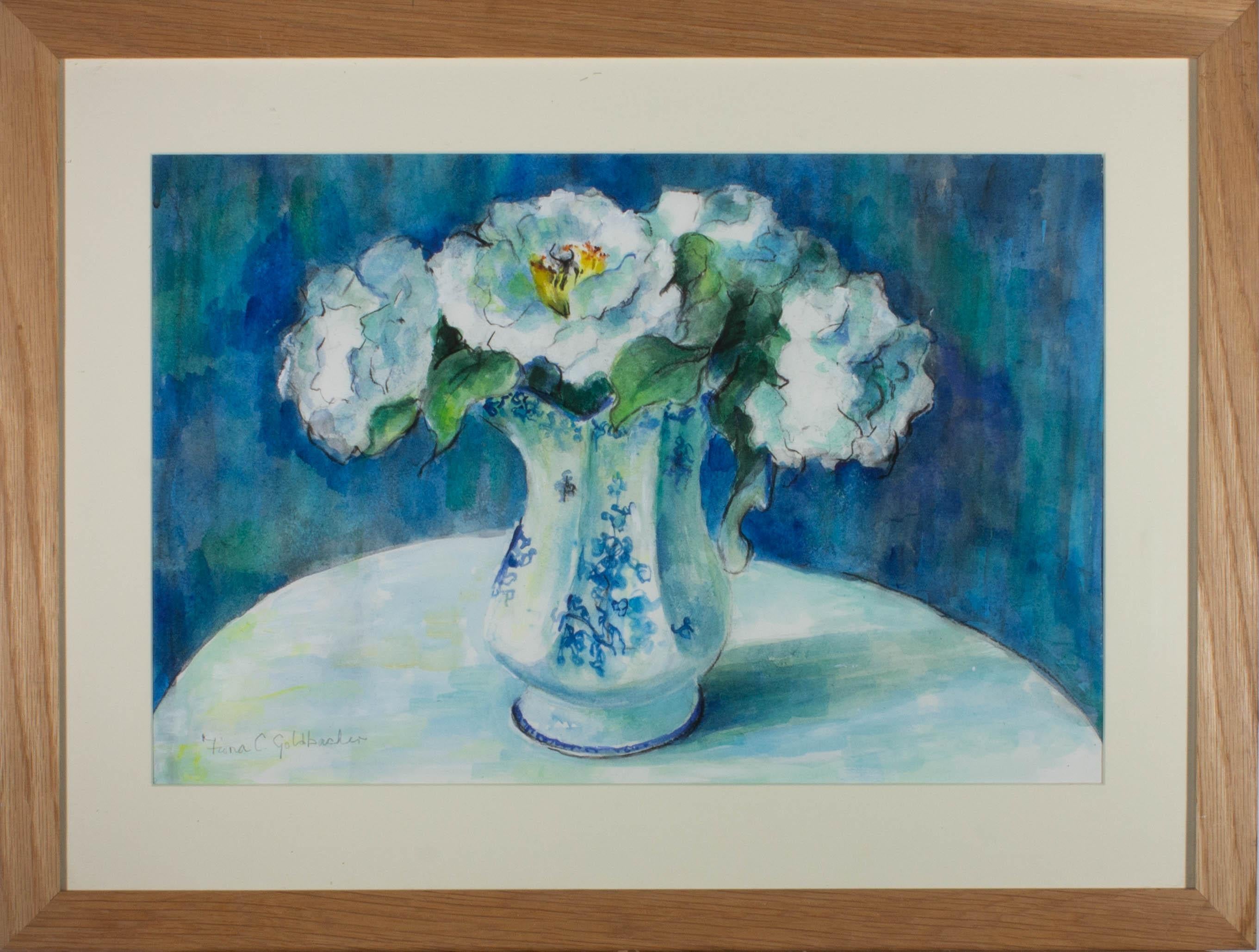 A pretty floral still life in a cool toned blue palette, showing a bunch of frothy white flowers in a blue and white china jug. The artist has signed to the lower left corner and the painting has been presented in a simple light oak frame with a