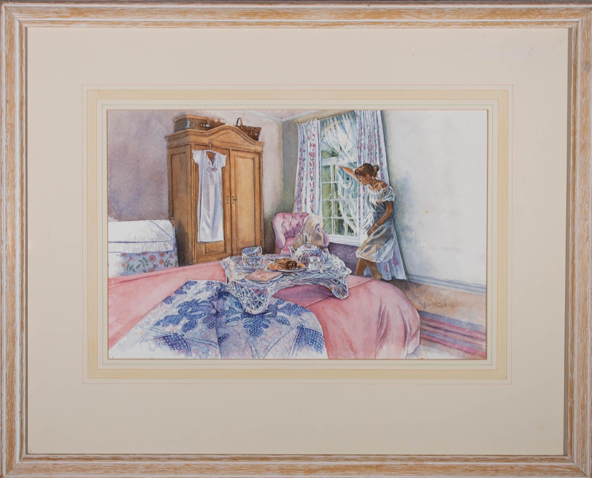 A charmingly intimate interior scene showing a woman in her bedroom with a breakfast on a wicker tray on her bed. The artist has signed to the lower right corner and the painting has been presented in a lime washed pine frame. There is a label at