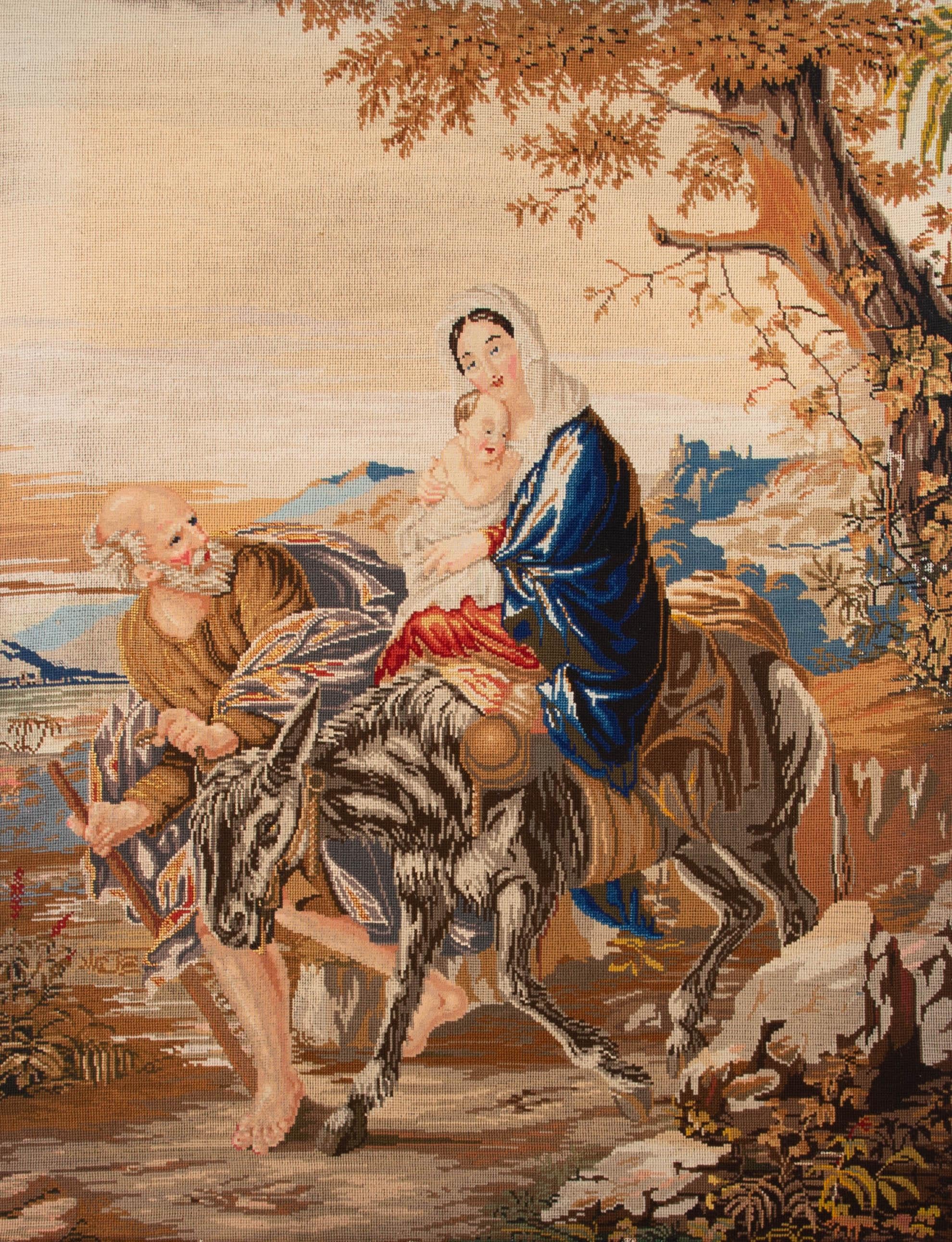 A charming needlepoint picture depicting Mary And Joseph fleeing with the baby Christ to Egypt to escape King Herod. On cotton on stretchers .

