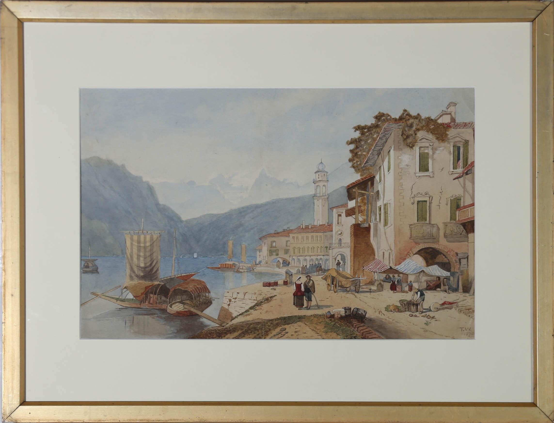 This delightful late 19th century watercolour depicting a riverside town in the Alps, with figures walking along the quiet promenade. The painting is signed and dated to the lower right-hand corner. Well presented in a smart white slip and