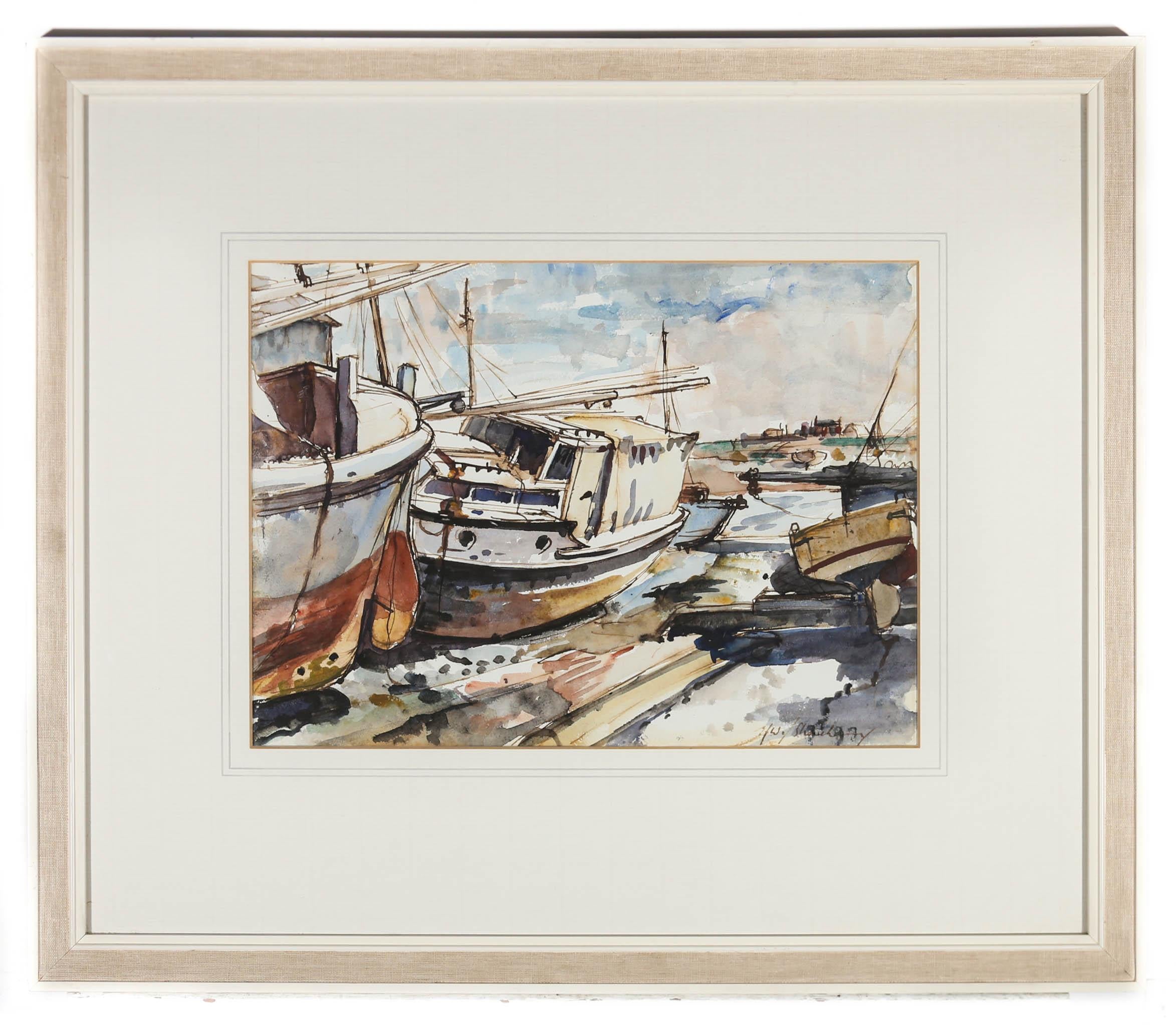 A charming Mid Century coastal watercolour, showing a group of fishing boats on wet sands at low tide. The artist has initialed and inscribed illegibly to the lower right and the painting has been presented in a 20th Century white frame with linen