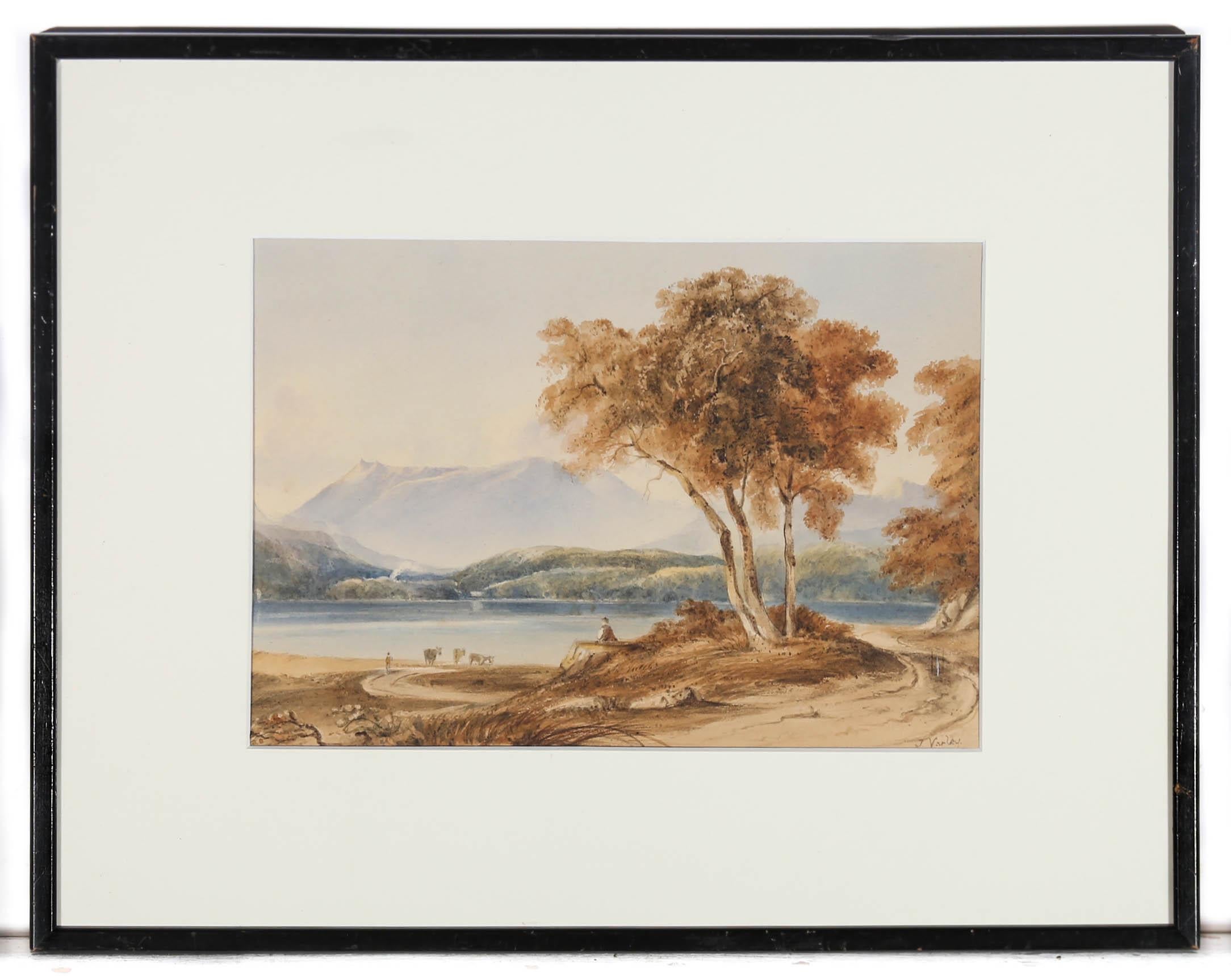 A charming watercolour scene depicting a mountain lake with cattle in the shallow water. the artist captures the landscape in fine detail from the foreground foliage to the distant mountain tops. Signed to the lower right. Presented in a