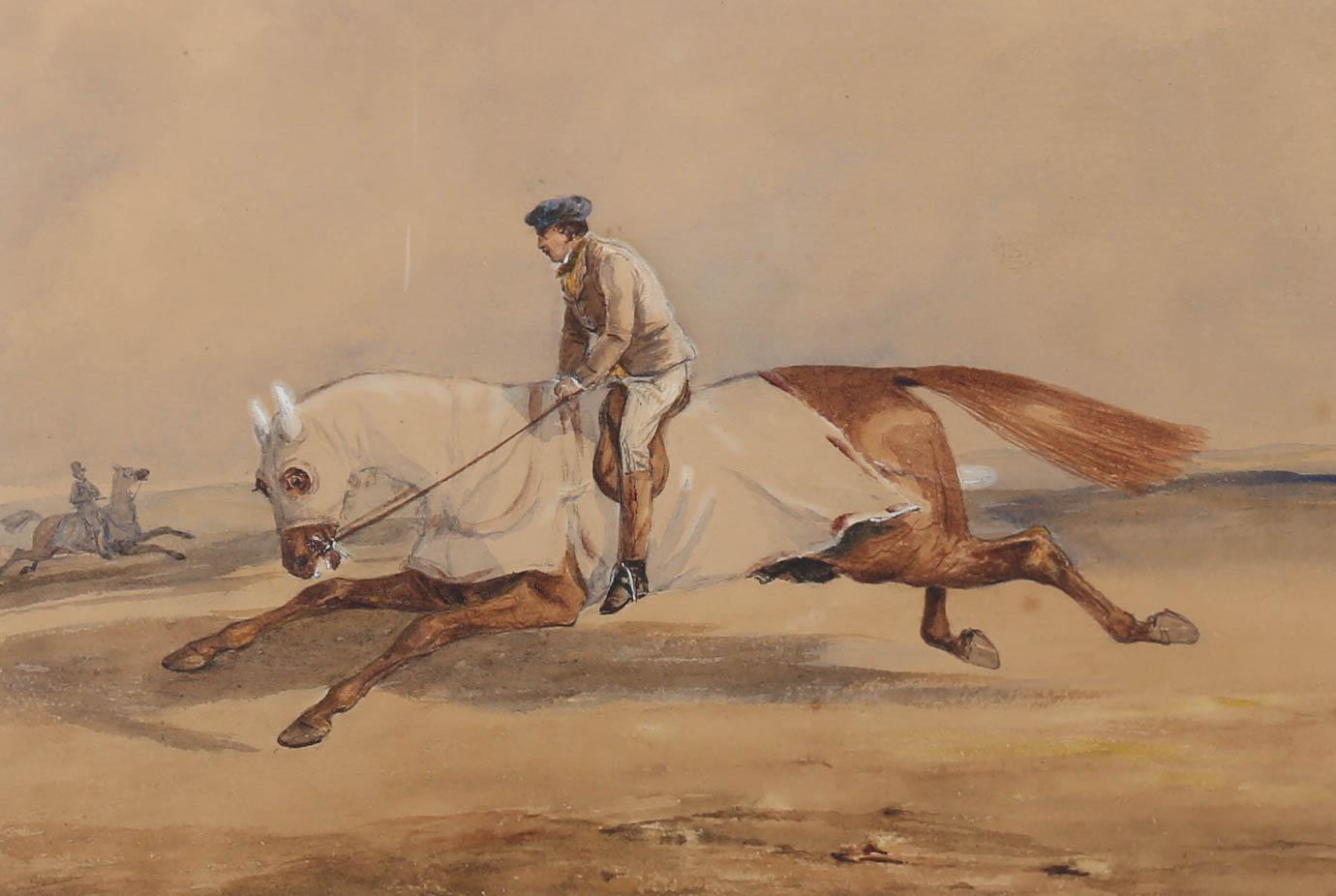 This charming watercolour shows a steady jockey exercising his owner's racehorse with a strong, galloping stride. The watercolour has been signed to the lower left. Immaculately presented in a crisp white mount and slim wood frame. On paper. 