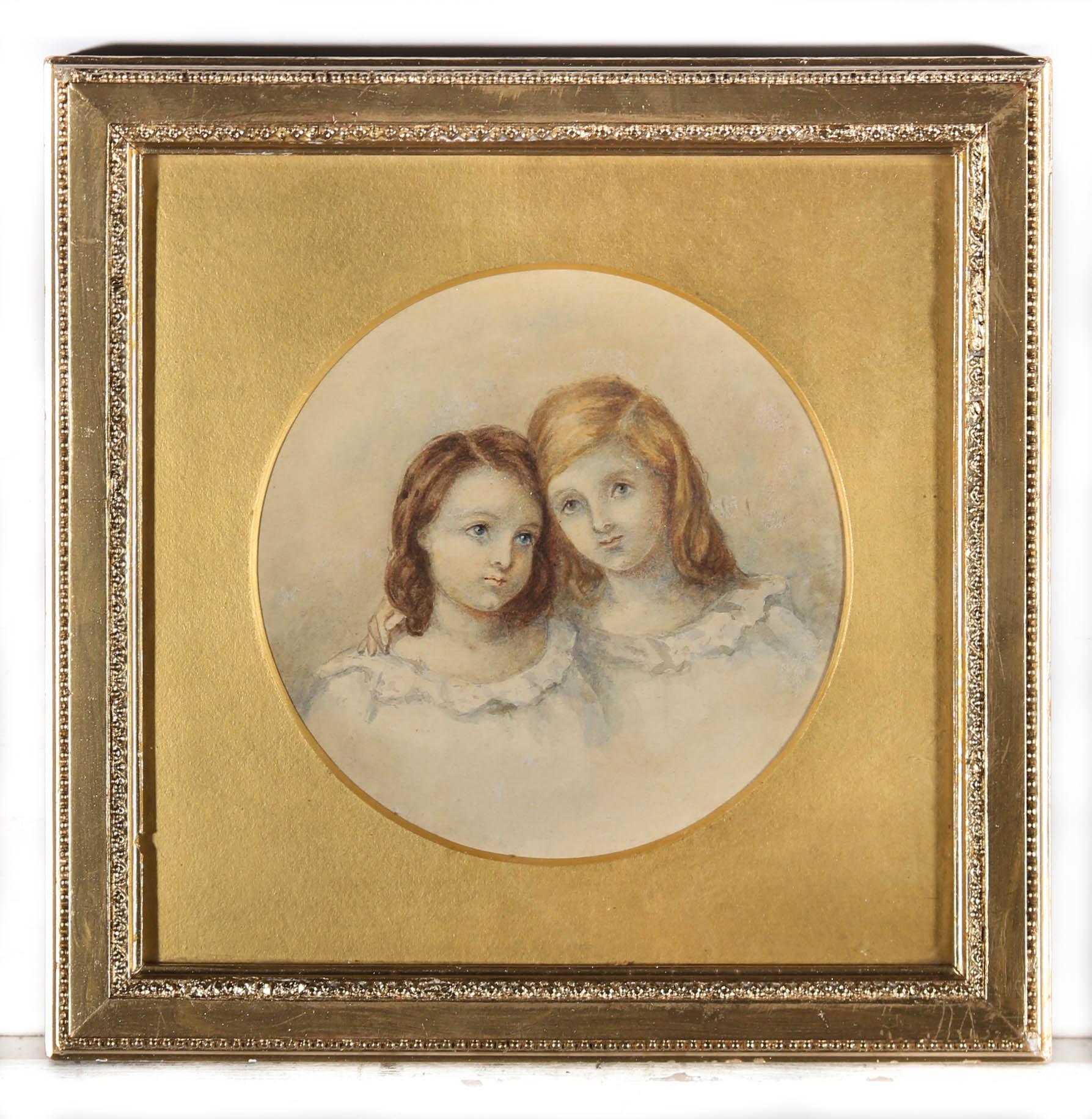 A fine watercolour portrait depicting two young sisters in matching gowns. The artist captures the children in delicate watercolour brush strokes showing their heads pressed together as they embrace,. Unsigned. Presented in a beaded gilt frame with