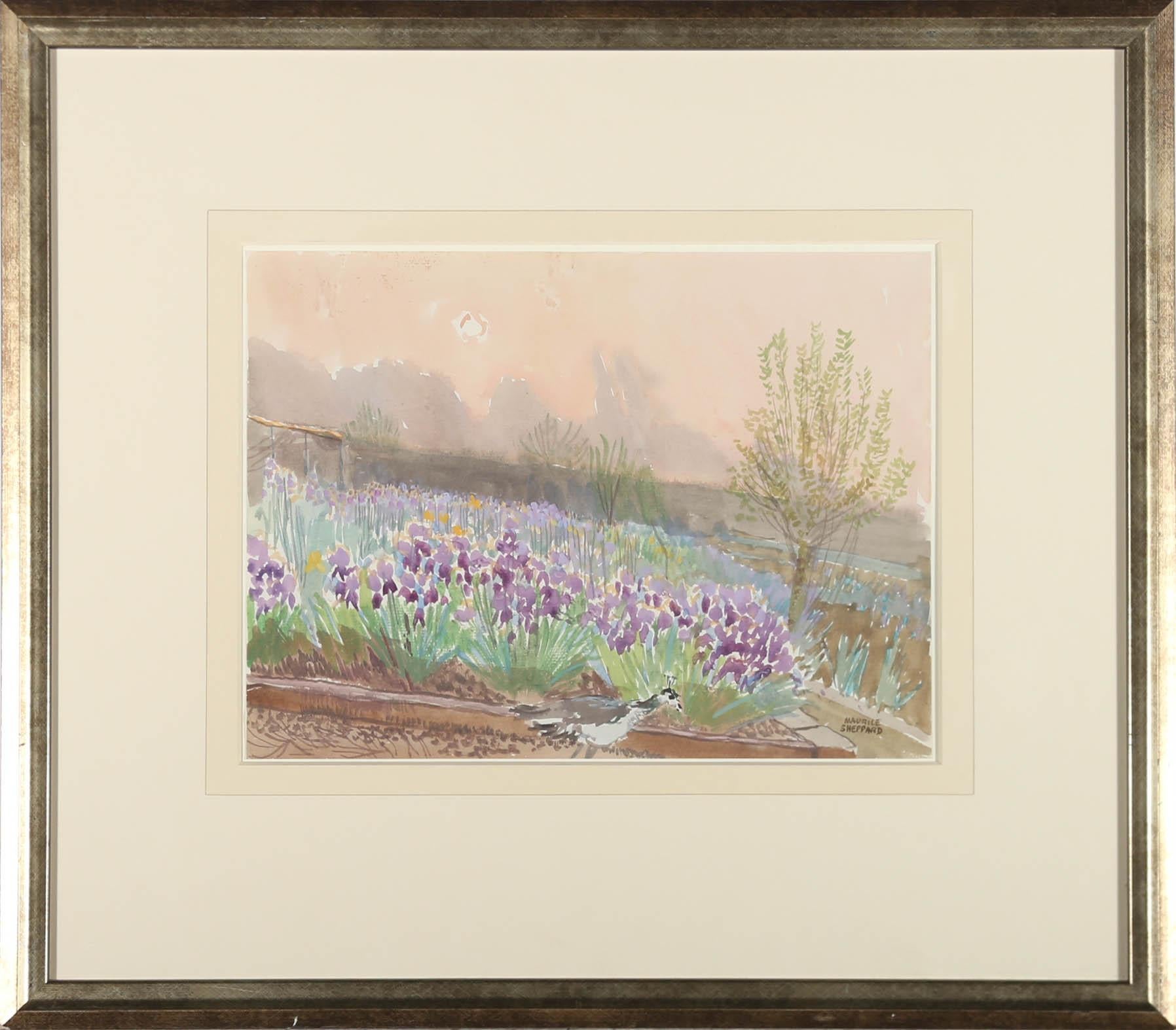 A charming study of a garden filled with irises with a peacock in the foreground. Signed to the lower right. Titled to the reverse. Presented in a gilt frame. On paper.