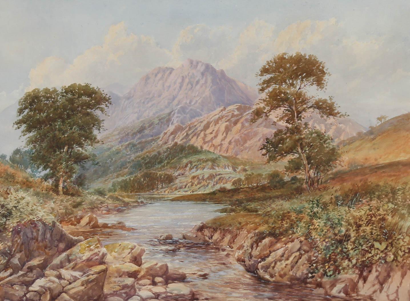A fine and delicate watercolour painting by John Wilson Hepple (1886-1939), depicting a rocky river scene with mountains in the distance. Signed and dated within the composition. Elegantly presented in a simple gilt frame and wash-line mount. On