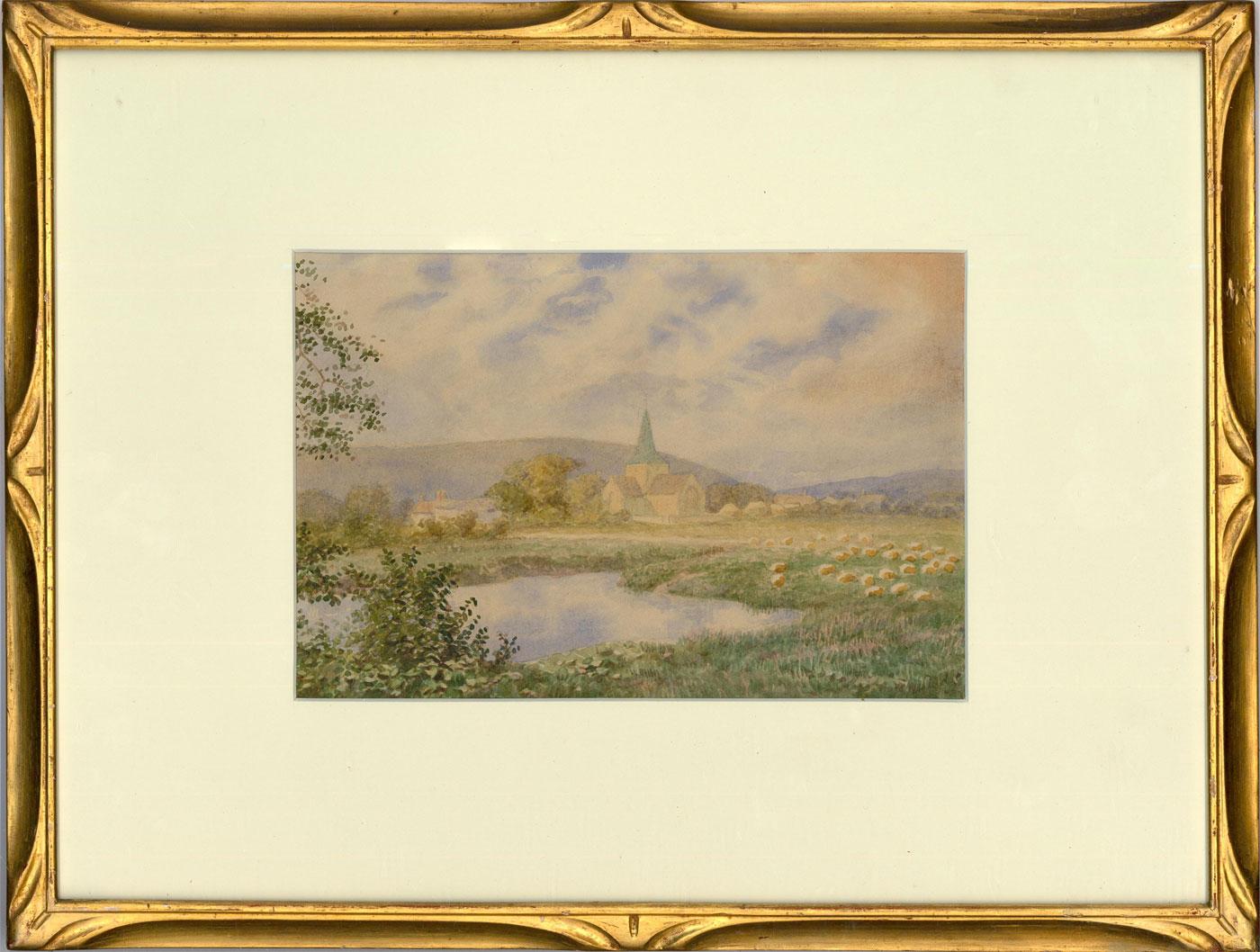 A charming late 19th century watercolour of a pastoral landscape, with church spire viewable from distance fields. The artist has signed the scene to the lower right and the watercolour has been well-presented in an elegant gilt frame with carved