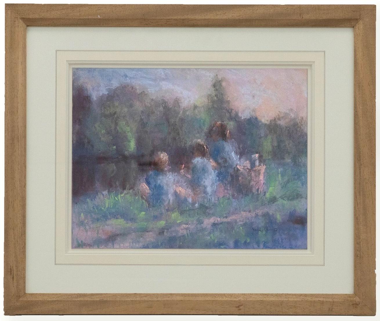 A charming pastel scene depicting three figures sat on a river verge of a river bank at sunset. The sunset in the distance casts a warm glow over the scene. Captured in a loose impressionist style. Signed to the lower right. Presented in a wooden