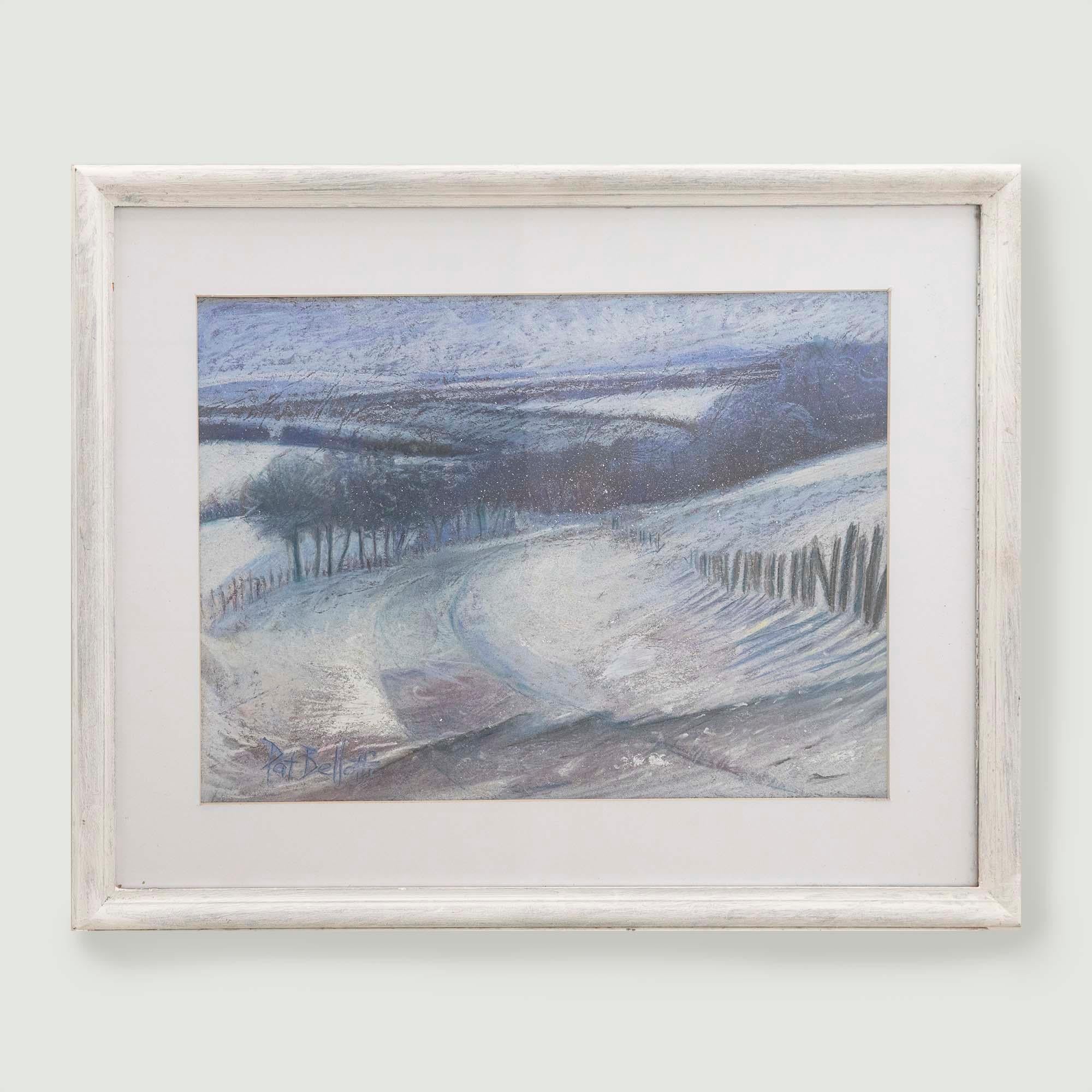 A winter landscape in oil pastel by 20th century artist, Patricia Bellotti. Signed to the lower left. Well-presented in a crisp white mount and whitewashed frame. On paper. 
