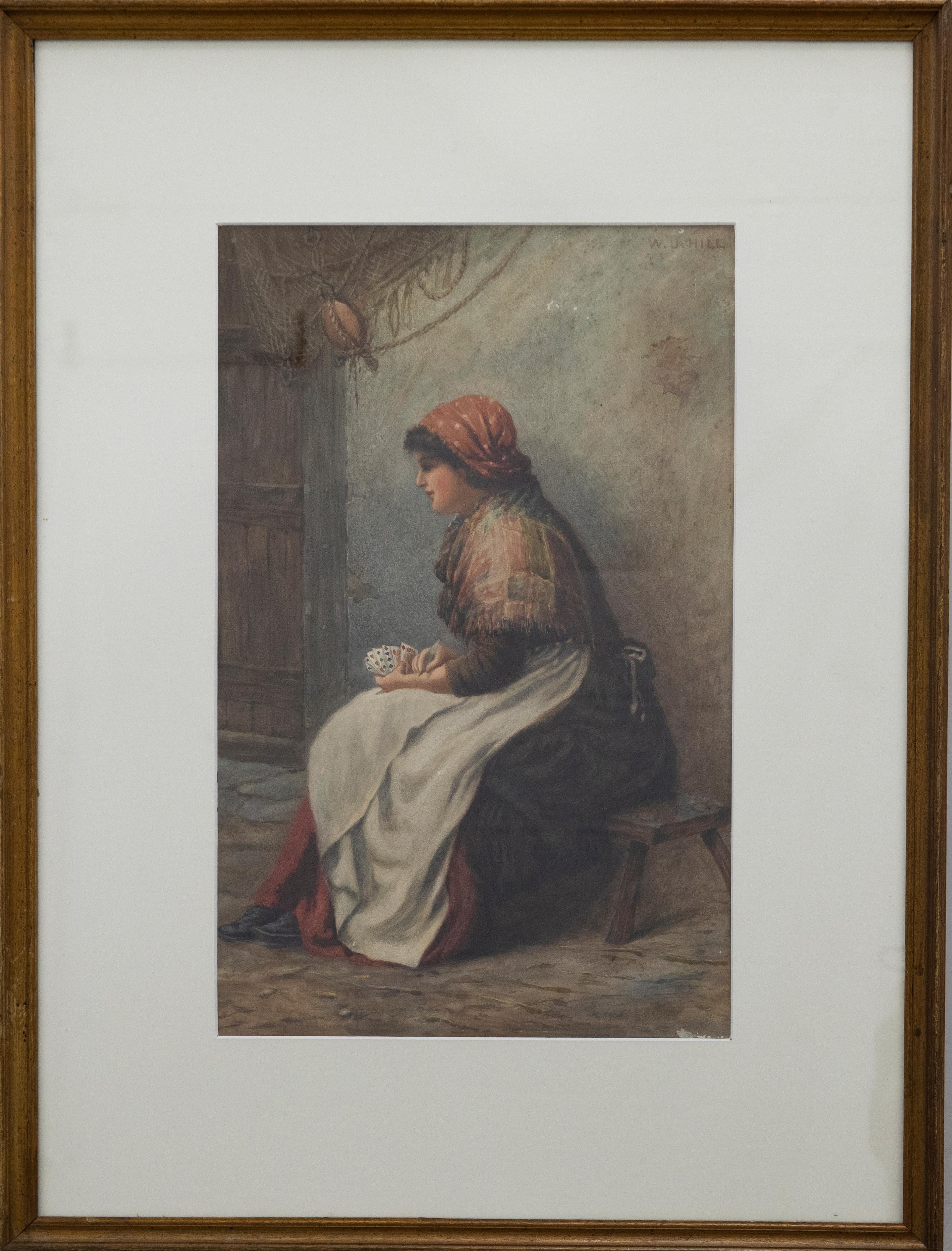 A charming 19th Century watercolour depicting a Fisherman's wife wrapped in a tartan shawl holding a hand of cards. The artist captures the woman in profile, sporting a dotted head scarf and sitting of a wooden bench. Behind her fishing nets hang