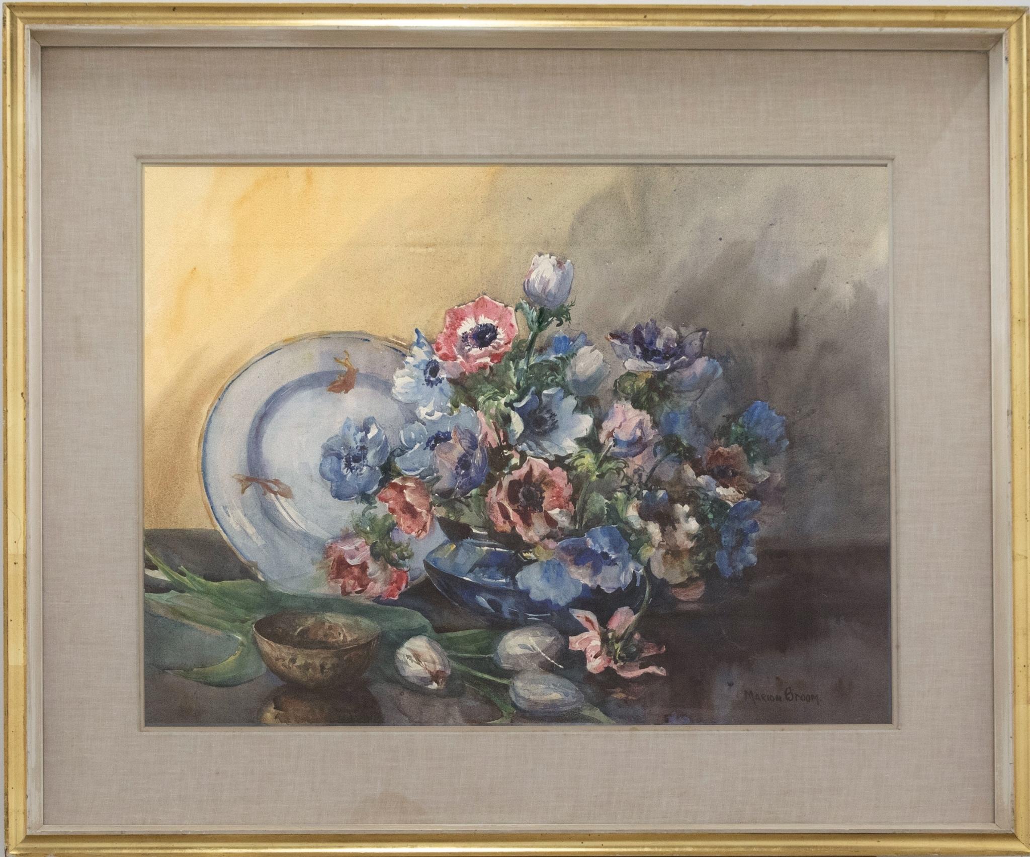 A fine floral watercolour showing a squat vase overflowing with colourful Anemones. A small bowl and a plate embellished with gold fish complete the still life. The artist has signed to the lower right corner and the painting has been presented in a