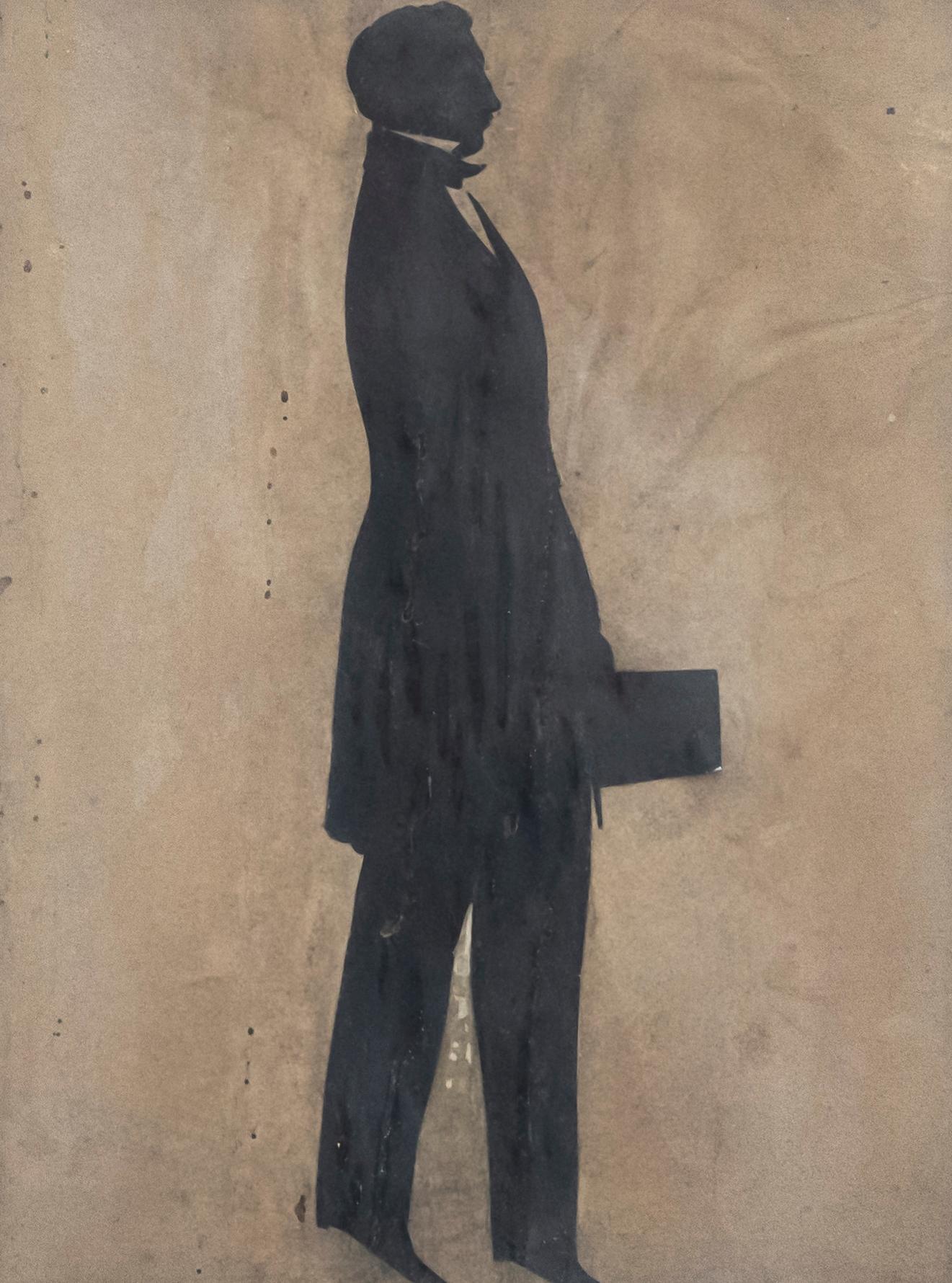 A delightful silhouette study of a man in fine dress carrying a bag. The figure is depicted on his toes giving him an air of elegance and poise. Unsigned. Presented in a dark wooden frame. On paper.
