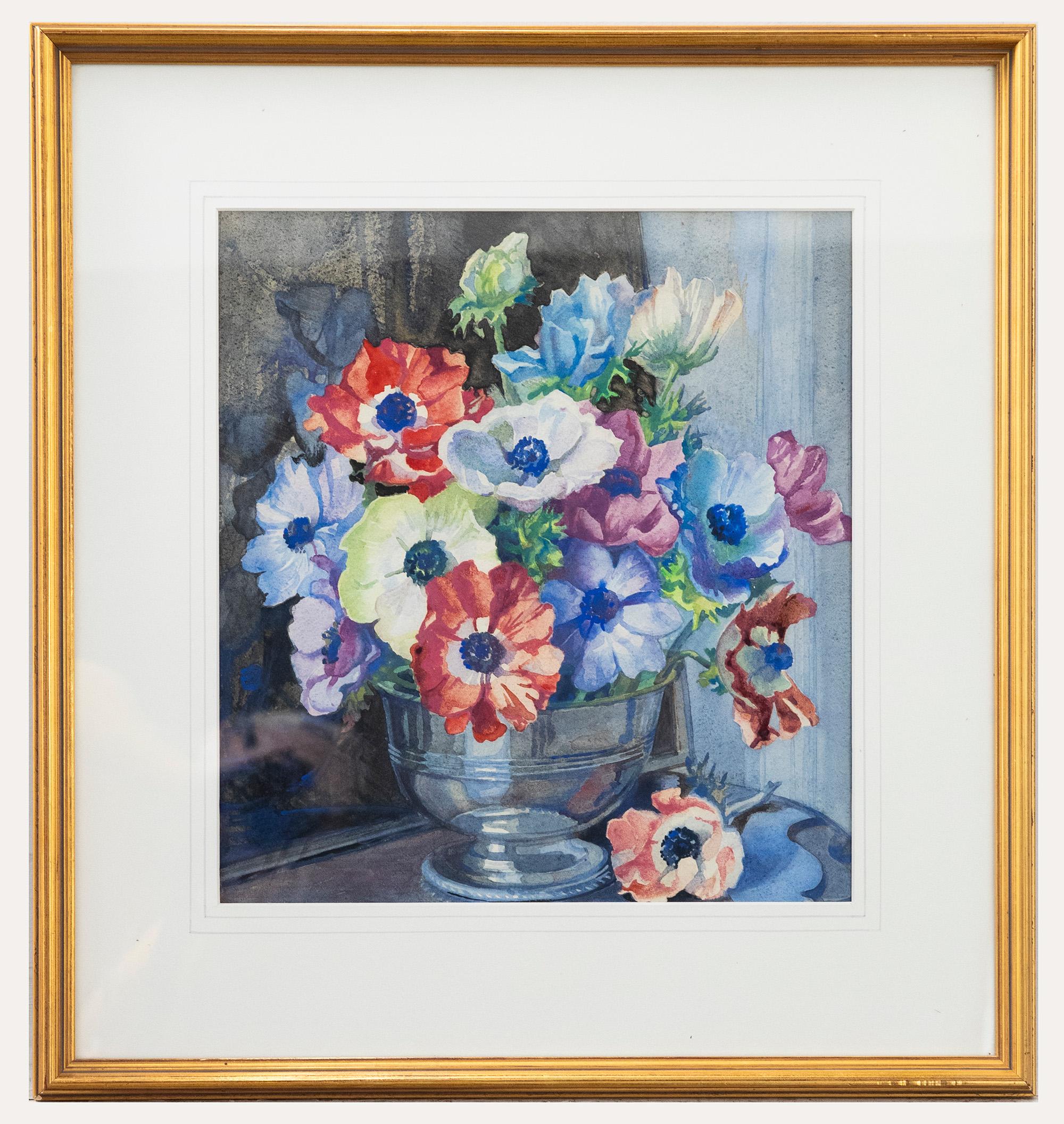 An accomplished still life of anemones in a bowl, painted in watercolours by Isabel Wrightson. Well- presented in a gilt-effect frame with wash-line mount. Affixed to the reverse of the frame is a signed artist label. On paper. 