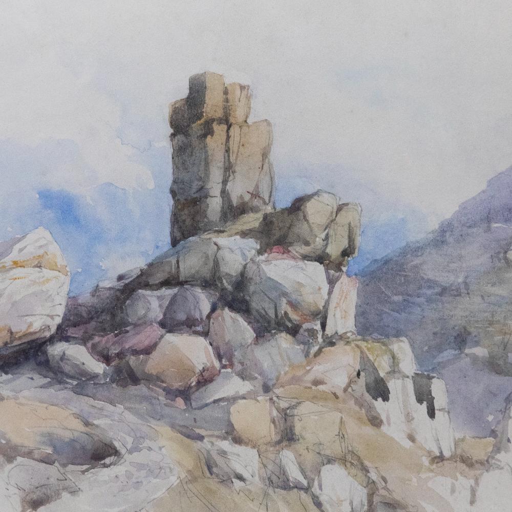 Feine Graphitstudie einer felsigen Landschaft, die mit Aquarellfarben laviert wurde. Unten links beschriftet: 