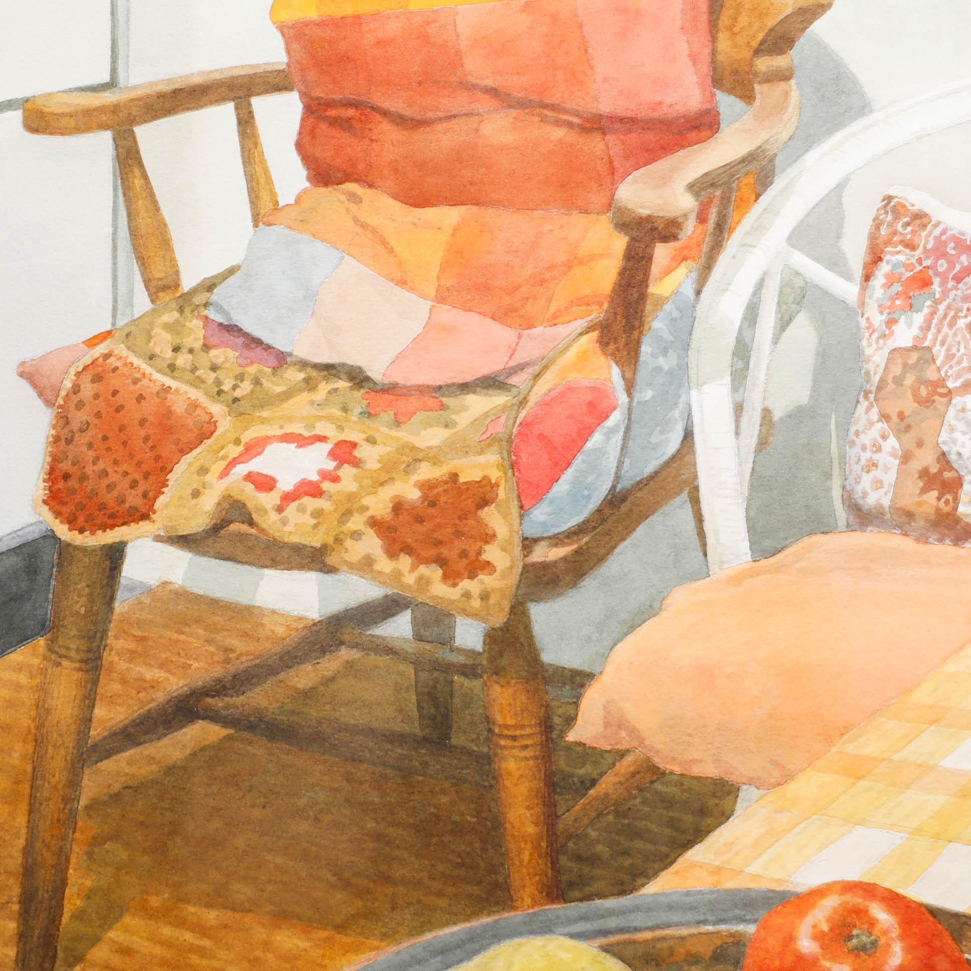 A delightful interior scene depicting a fruit bowl on a gingham tablecloth before a rustic chair. Signed with a monogram to the lower right. Presented in a wooden frame. On paper.