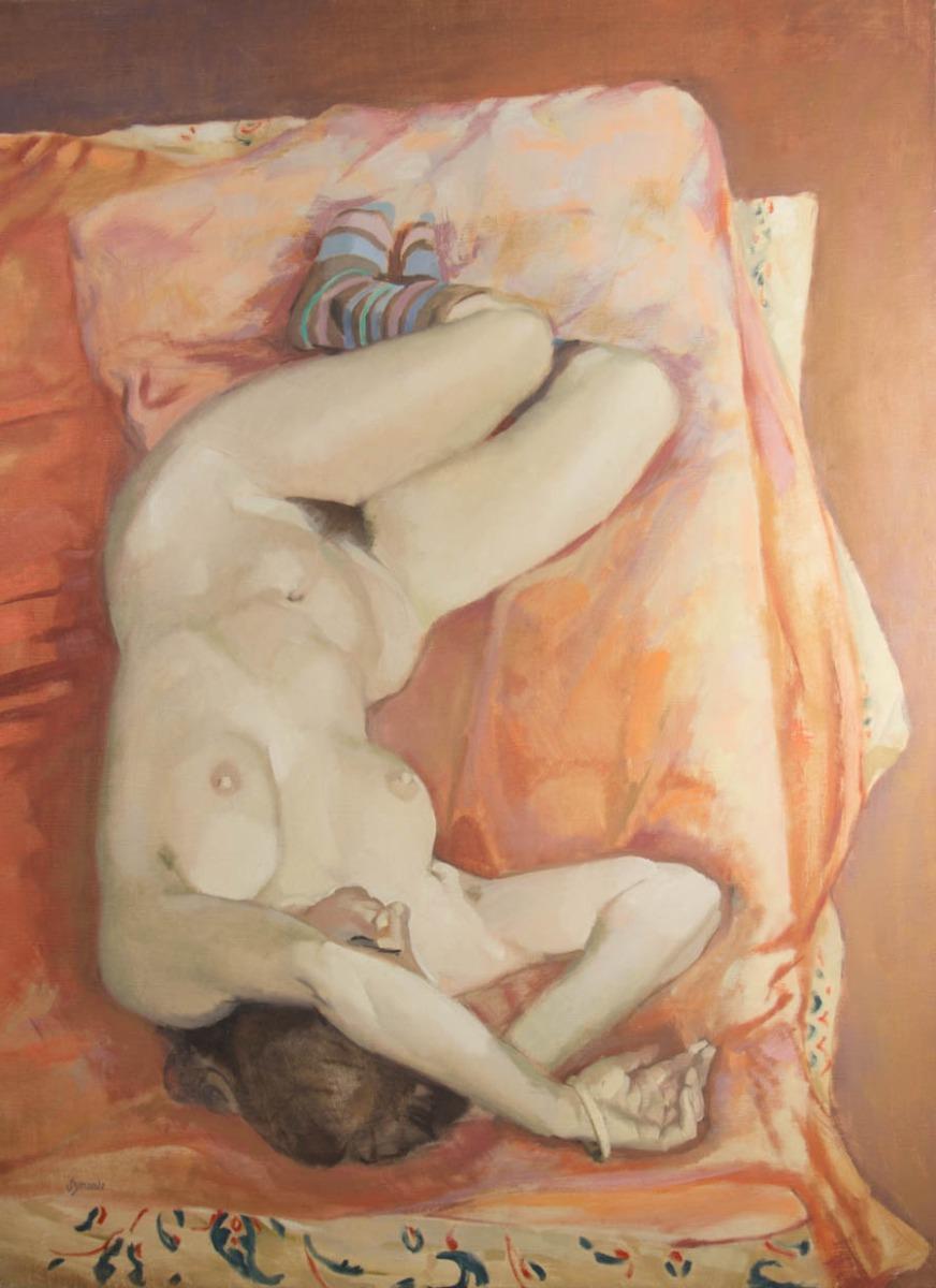 An accomplished oil painting by the Newlyn School artist Ken Symonds. The scene depicts a nude female figure wearing colourful striped socks and a bangle bracelet on her left wrist, whilst lying comfortably on a bed. In warm earth tones and thick