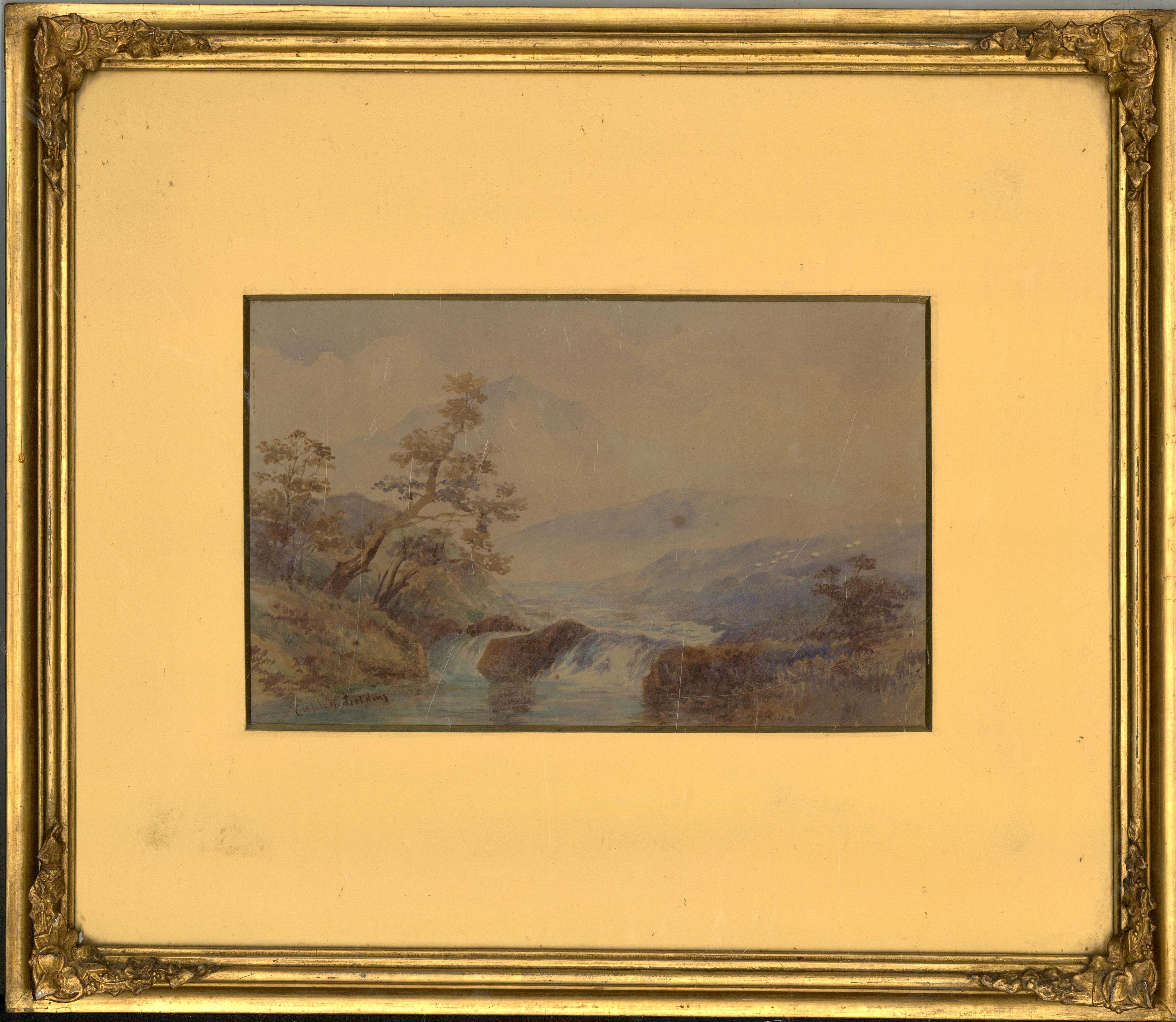 A charming watercolour landscape depicting a tranquil weir and distant mountains. Possibly a quick 'en-plein-air' sketch by the artist. Well presented in a gilt effect mount and frame with corner moulding detail. Signed. On watercolour paper.
