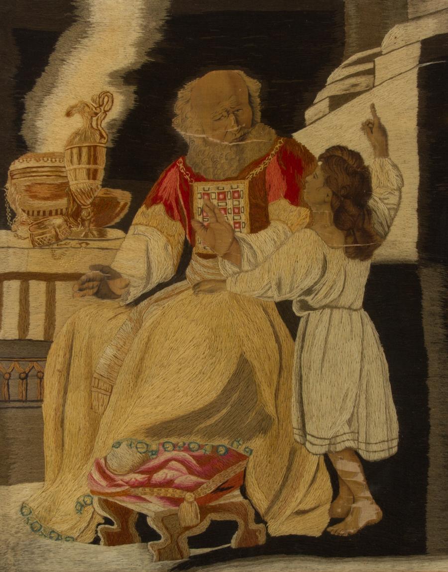 An outstanding early 19th Century silkwork embroidery on fabric canvas, with watercolour painted figures, depicting a classical bearded gentleman with a young girl in traditional dress. The scene has a religious air, with the girl pointing upwards