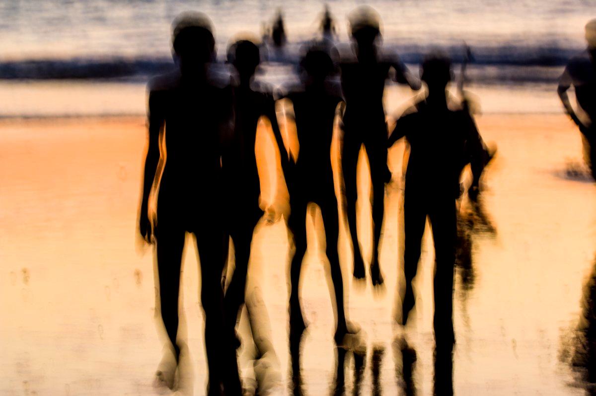 There is a something about being a child on the beach where the sheer exuberance of running into the waves transcends the normal social barriers, and the shared exhilarance allows for instant friendship.

These temporary friends are quickly