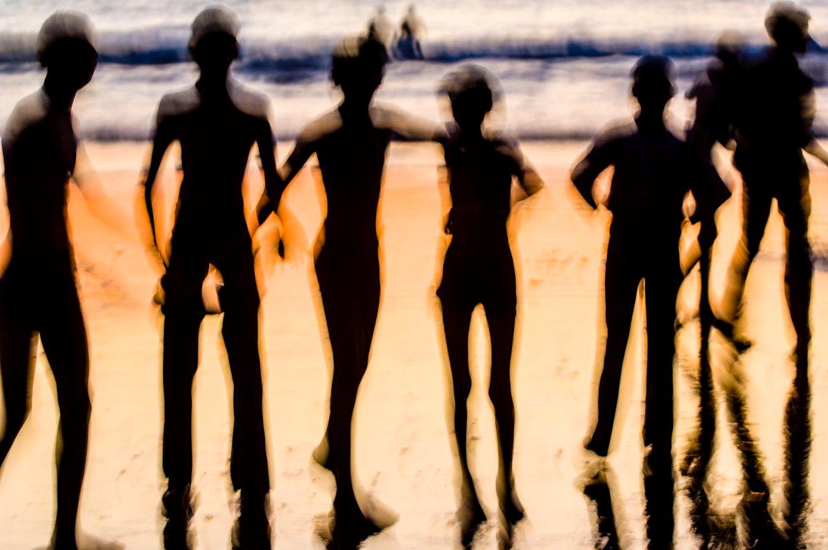 There is a something about being a child on the beach where the sheer exuberance of running into the waves transcends the normal social barriers, and the shared exhilarance allows for instant friendship.

These temporary friends are quickly