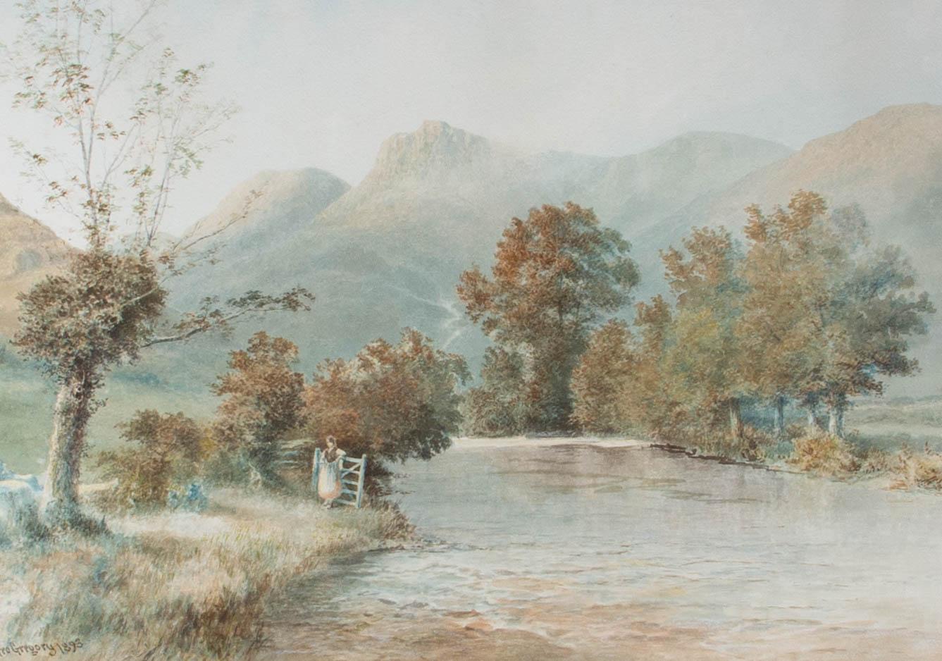 A large watercolour landscape featuring a woman resting by a gate on a riverbank. Tall mountains fill the background. Presented unglazed in a cream wash line and gold double mount and a distressed gilt-effect wooden frame. Signed and dated to the