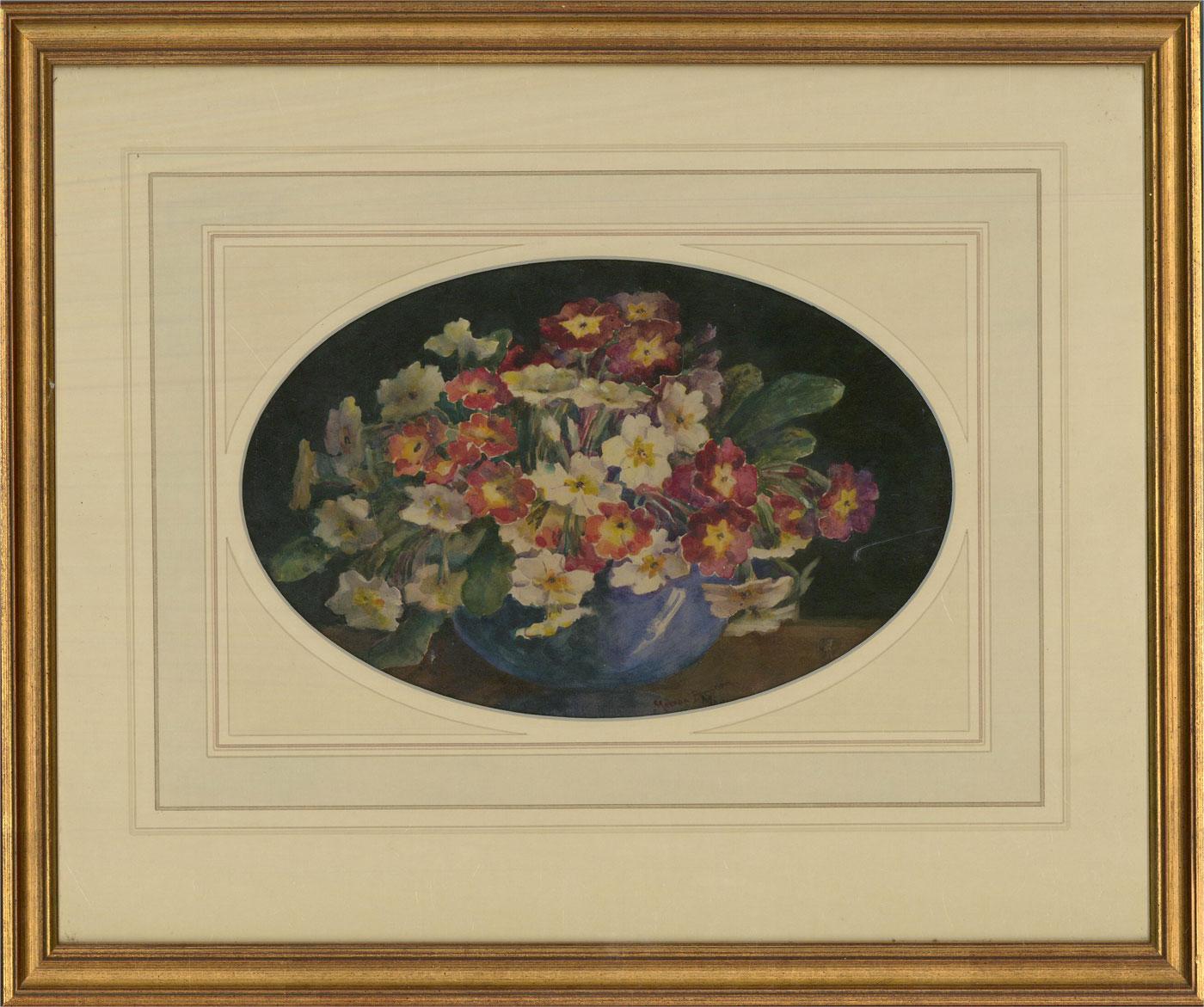 An attractive watercolour painting by the artist Marion Broom, depicting a blue vase with flowers. Signed to the lower margin. Well-presented in an oval, wash line card mount and in a distressed, gilt-effect frame. On watercolour paper.
