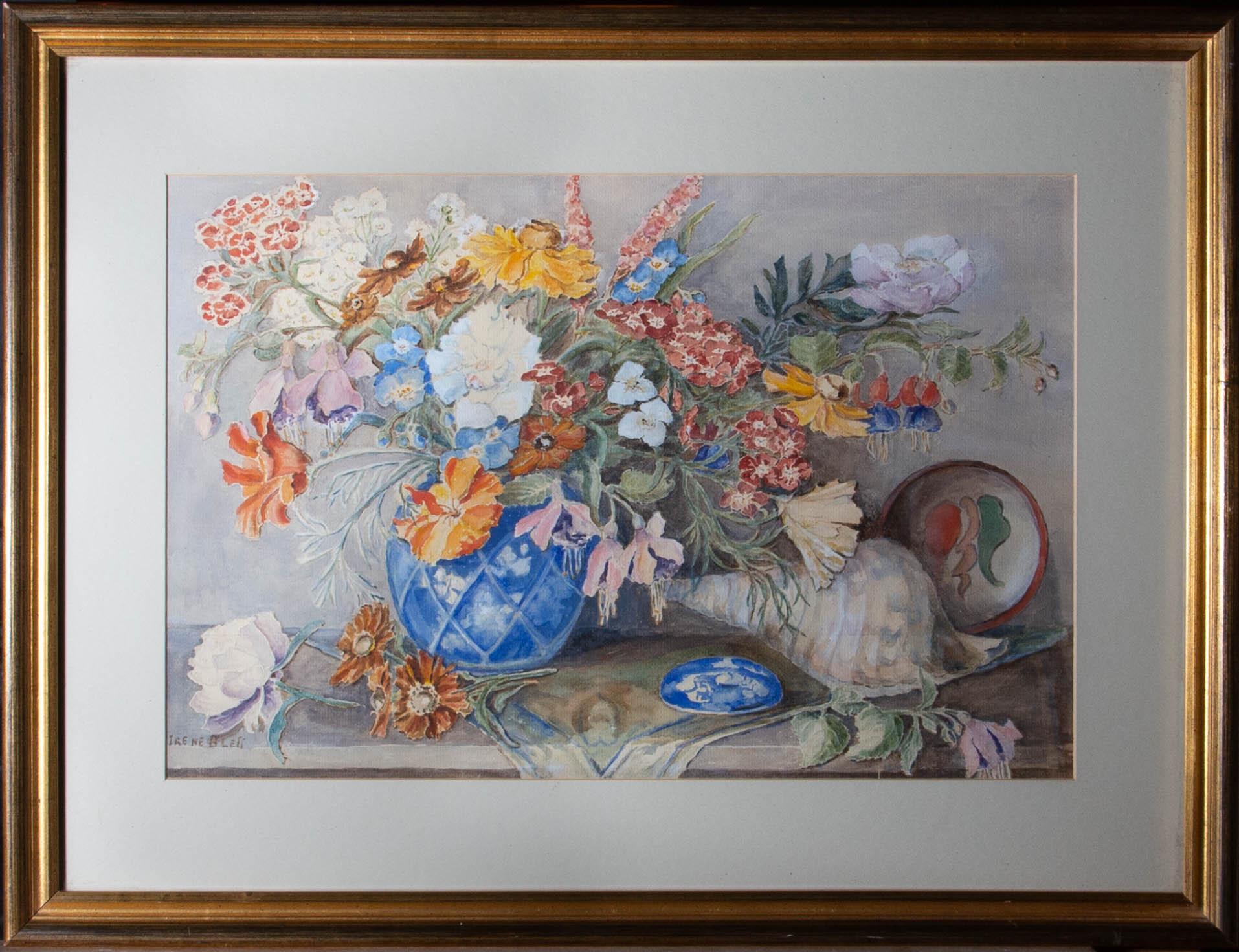 A joyful and vibrant floral study showing a ginger jar, with its top next to it, filled with gorgeously bright blooms, including fuchsias, peonies, sweet William, auricula, periwinkles and many more. The artist has signed to the lower left corner