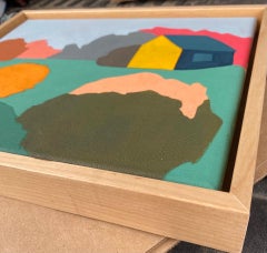 Blue and Yellow House with Flowering Hedges