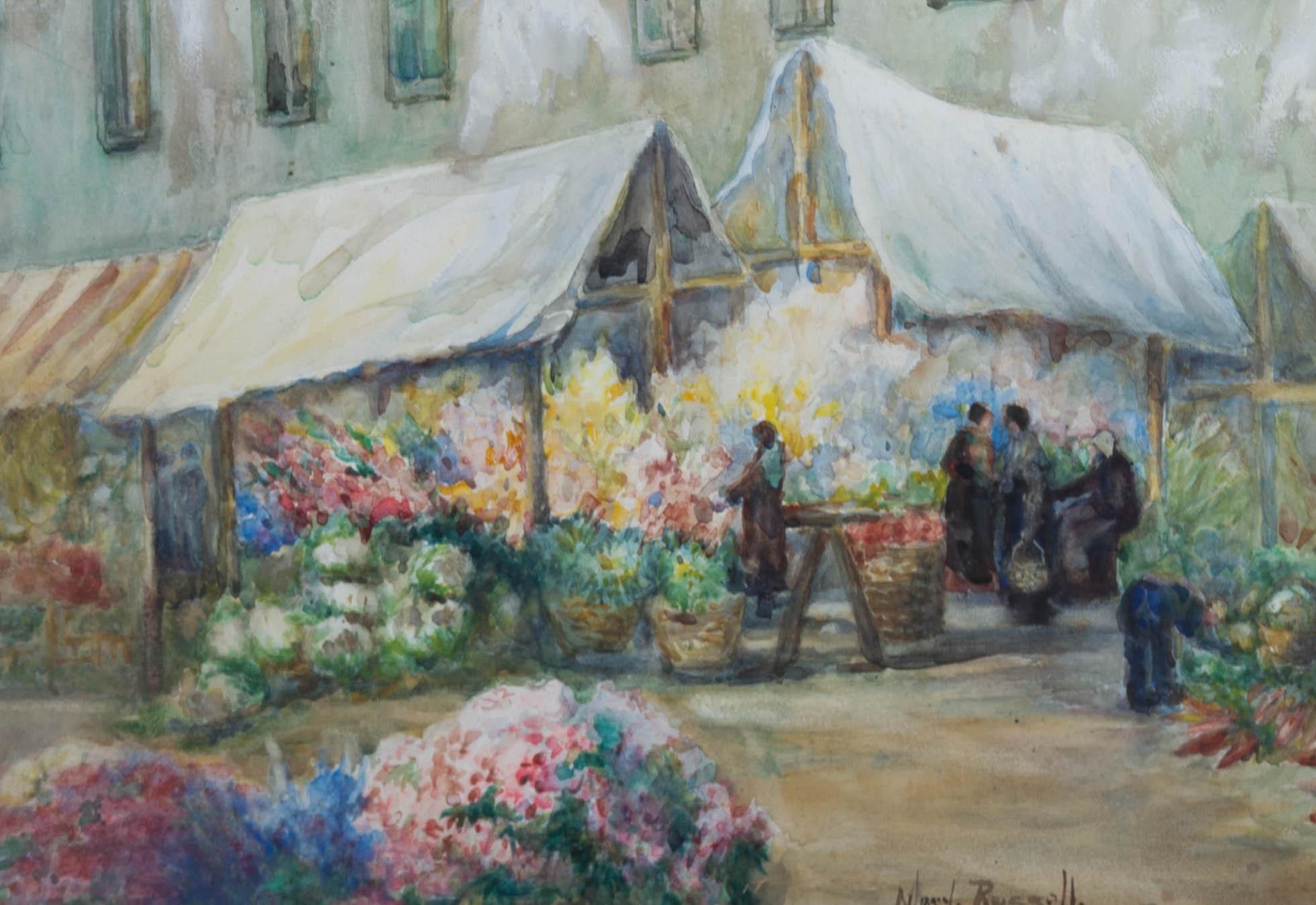 This charming watercolour scene depicts a vibrant flower market in Dieppe, France. Figures with large baskets browse the selection of bright flowers on the narrow French Street. Painted in an impressionist style with soft watercolour hues. Label