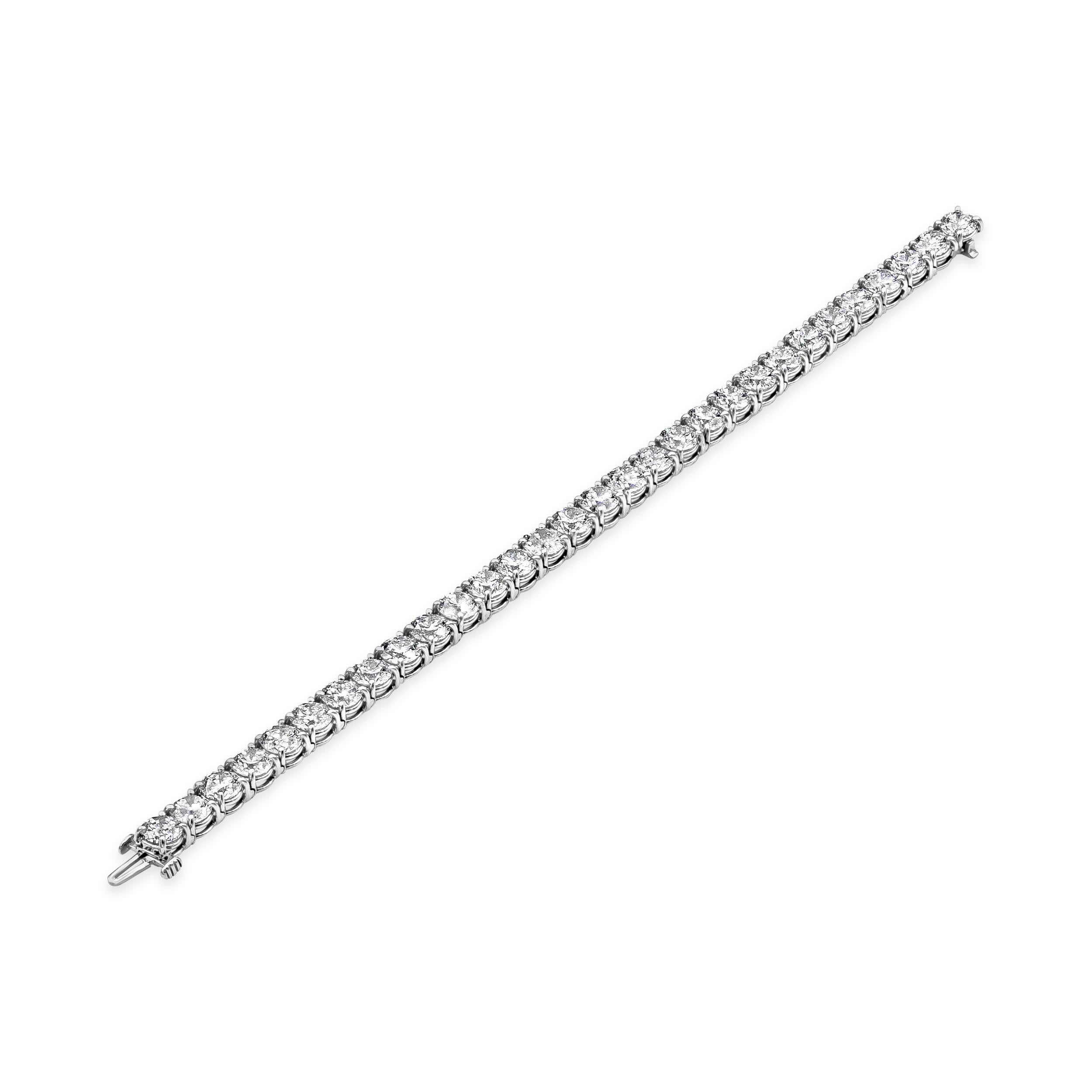 A classic tennis bracelet style showcasing  a row of round brilliant diamonds in a four-prong open gallery setting. Diamonds weigh 22.58 carats total. Made with platinum and 7 inches in Length.

Roman Malakov is a custom house, specializing in