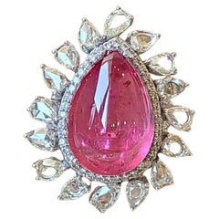 22.58 Carats, Pear Shaped, Rubellite Cabochon 
Rose Cut Diamonds Cocktail Ring