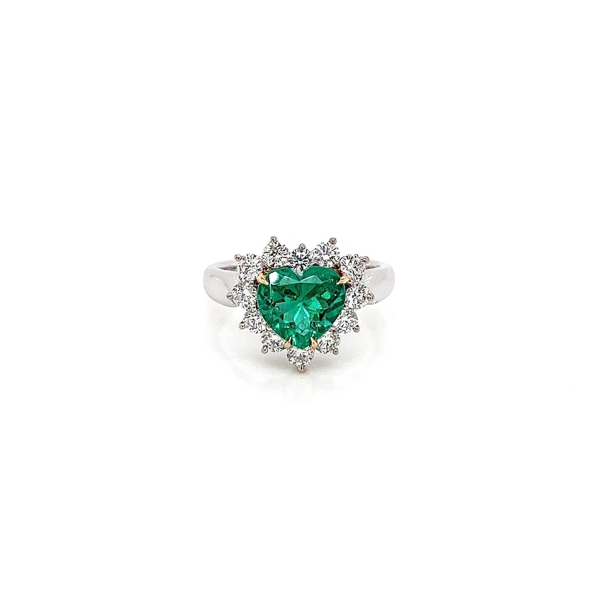 2.25 Total Carat Green Emerald and Diamond Ladies Ring

-Metal Type: 18K White Gold 
-1.52 Carat Heart-Shaped Columbian Green Emerald
-0.73 Carat Round Natural Diamonds, F-G Color, VS-SI Clarity
-Size 6.25

Made in New York City