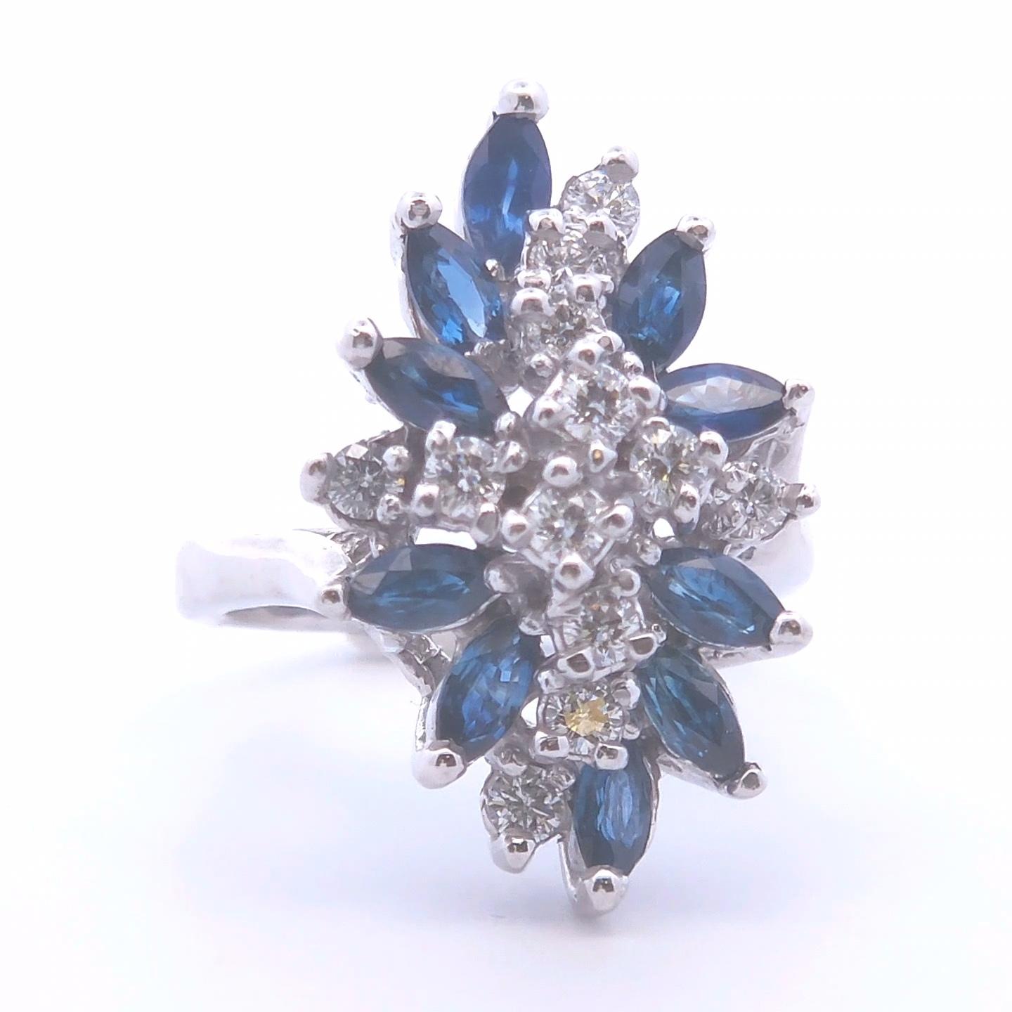 Introducing our exquisite 2.25ct Marquise Sapphire Ring, meticulously crafted in 14k White Gold. This stunning piece showcases multiple marquise-shaped sapphires, totaling an impressive 1.74ct, each one radiating a deep, captivating blue hue.